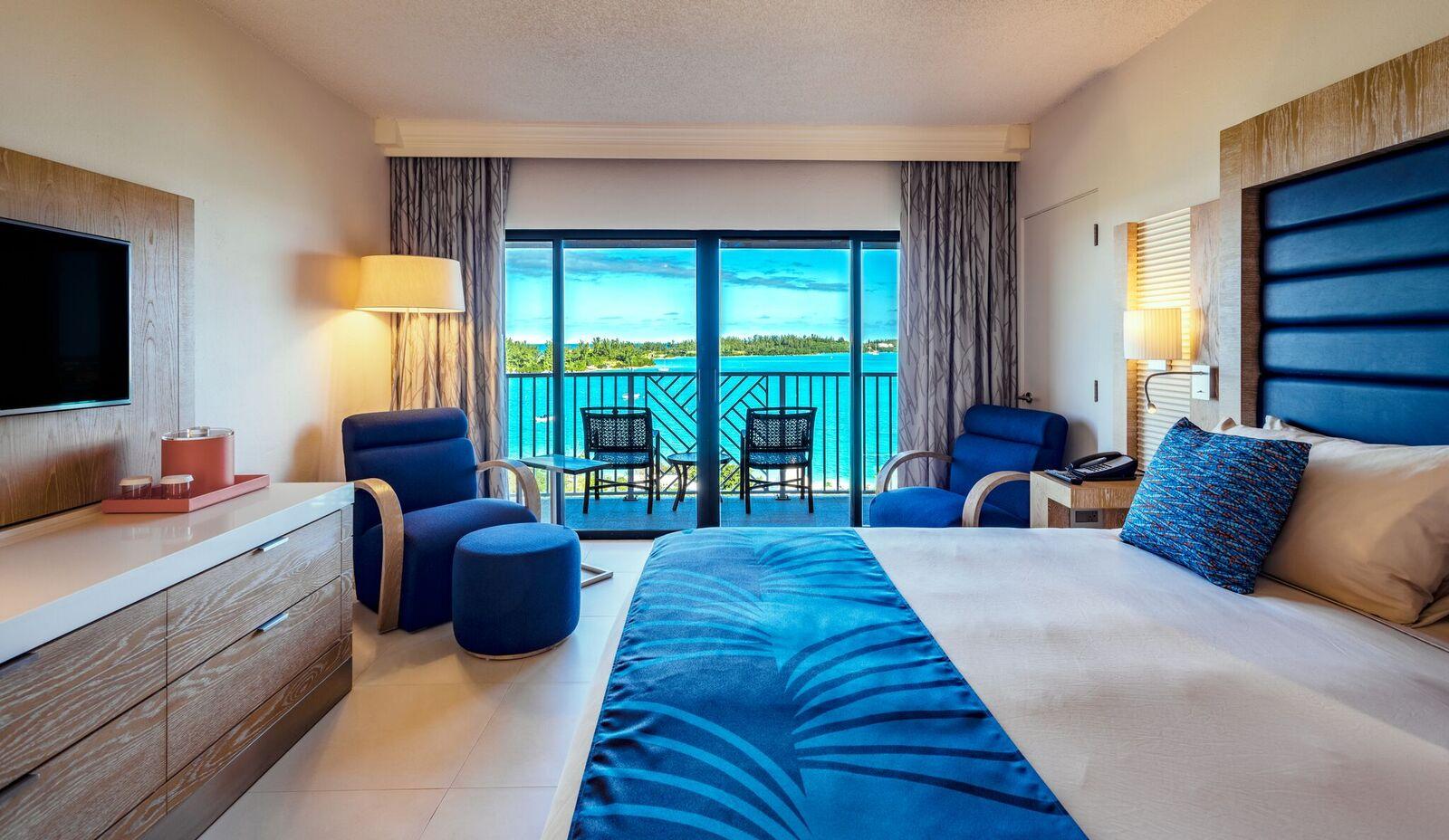 Double bed room suite at the resort with balcony views of the ocean