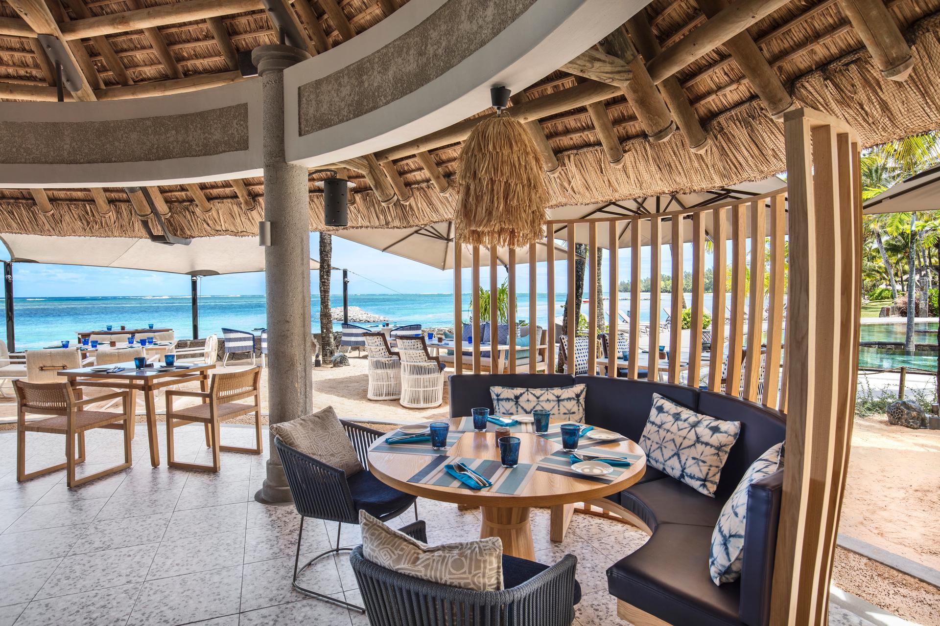 An outdoor seating area at the resort with beach views