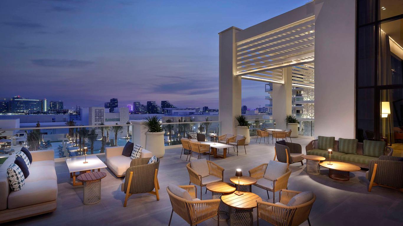 A roof top lounging area with city views at the Hilton Abu Dhabi Yas Island