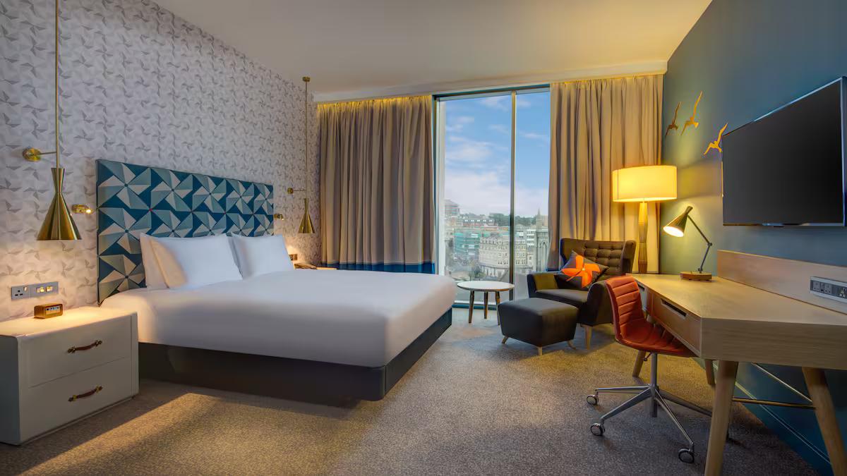 Double bed suite at the Hilton hotel with a modern design, smart TV and city views