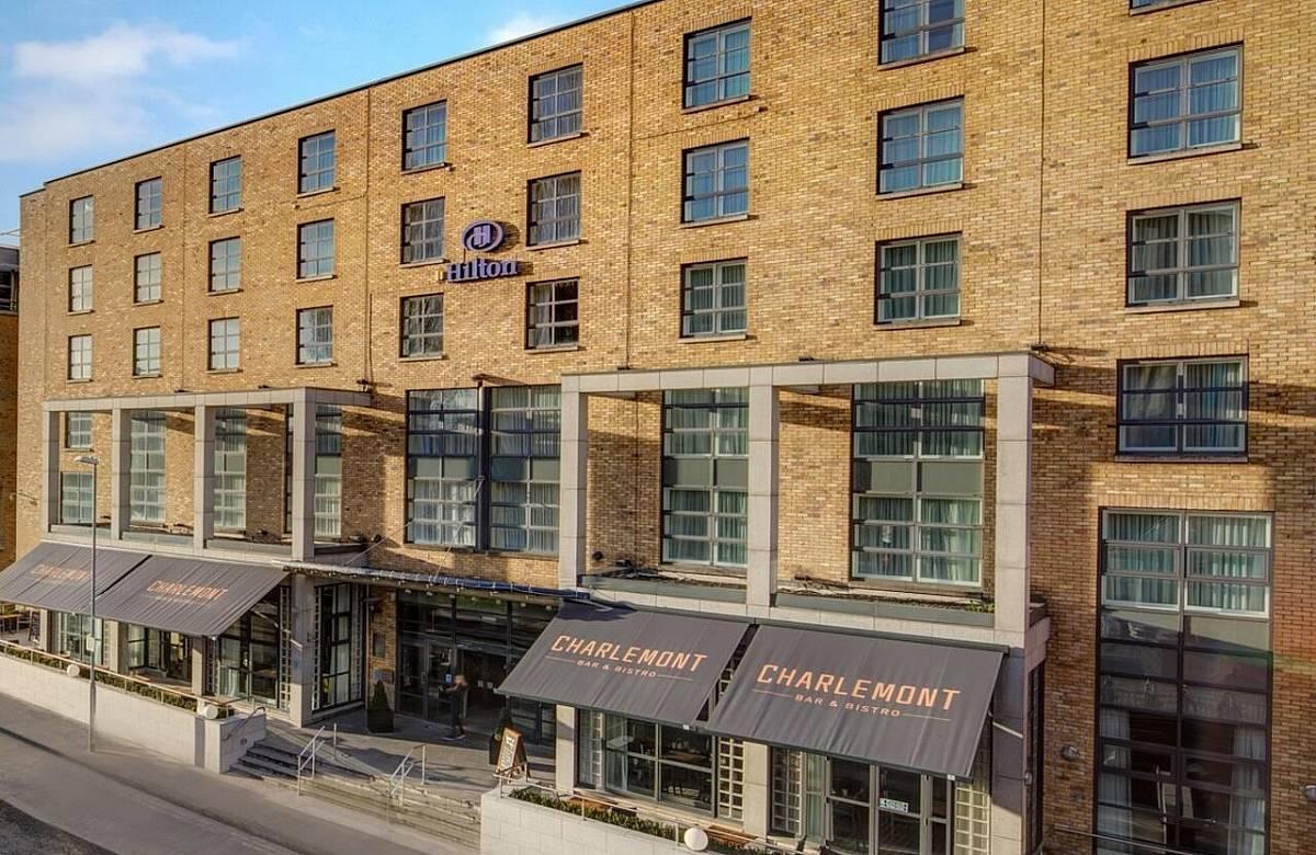 Close-up view of Hilton Dublin's entrance and outdoor dining area.