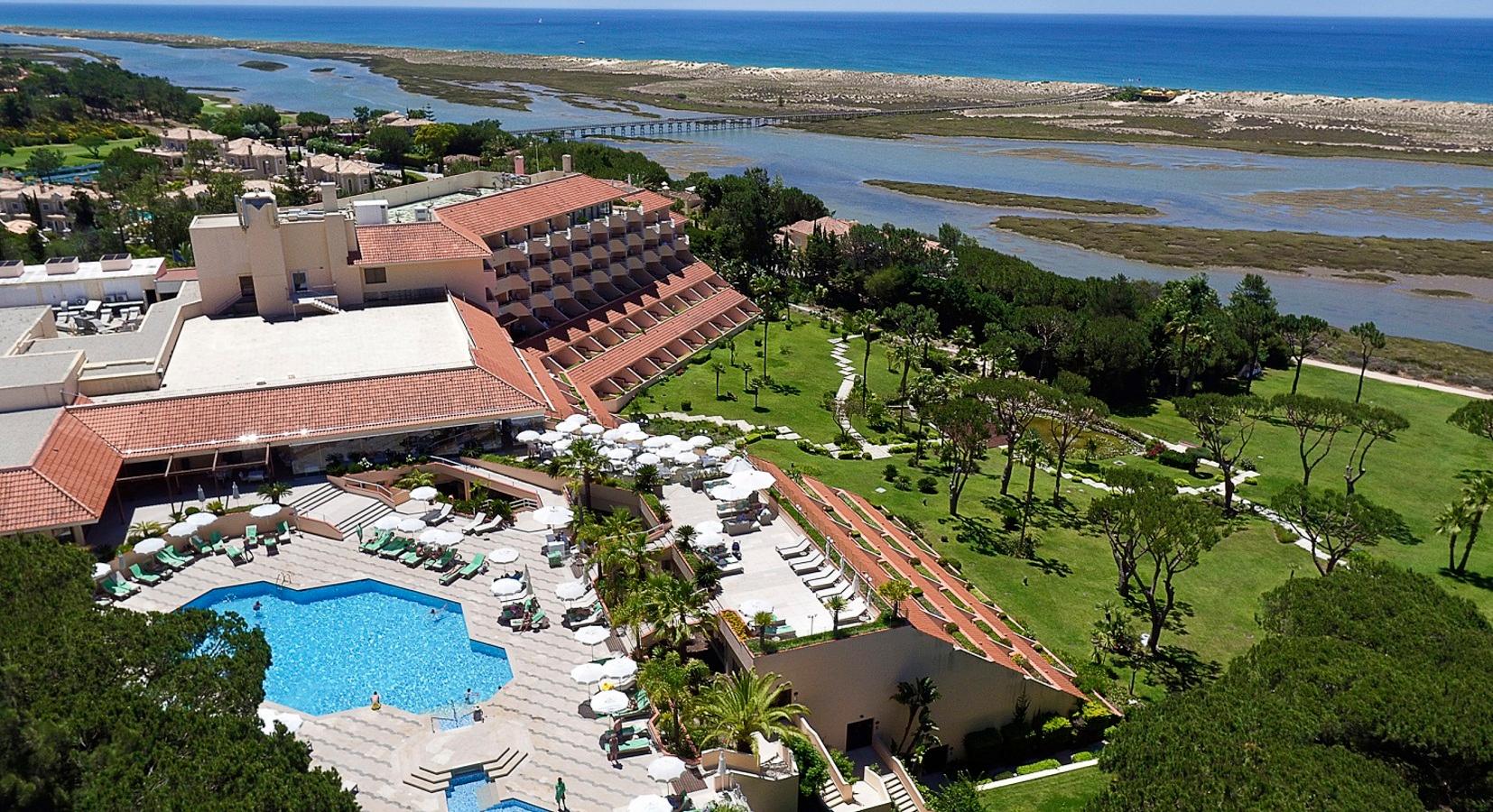 Aerial view revealing the rooftop swimming pool area