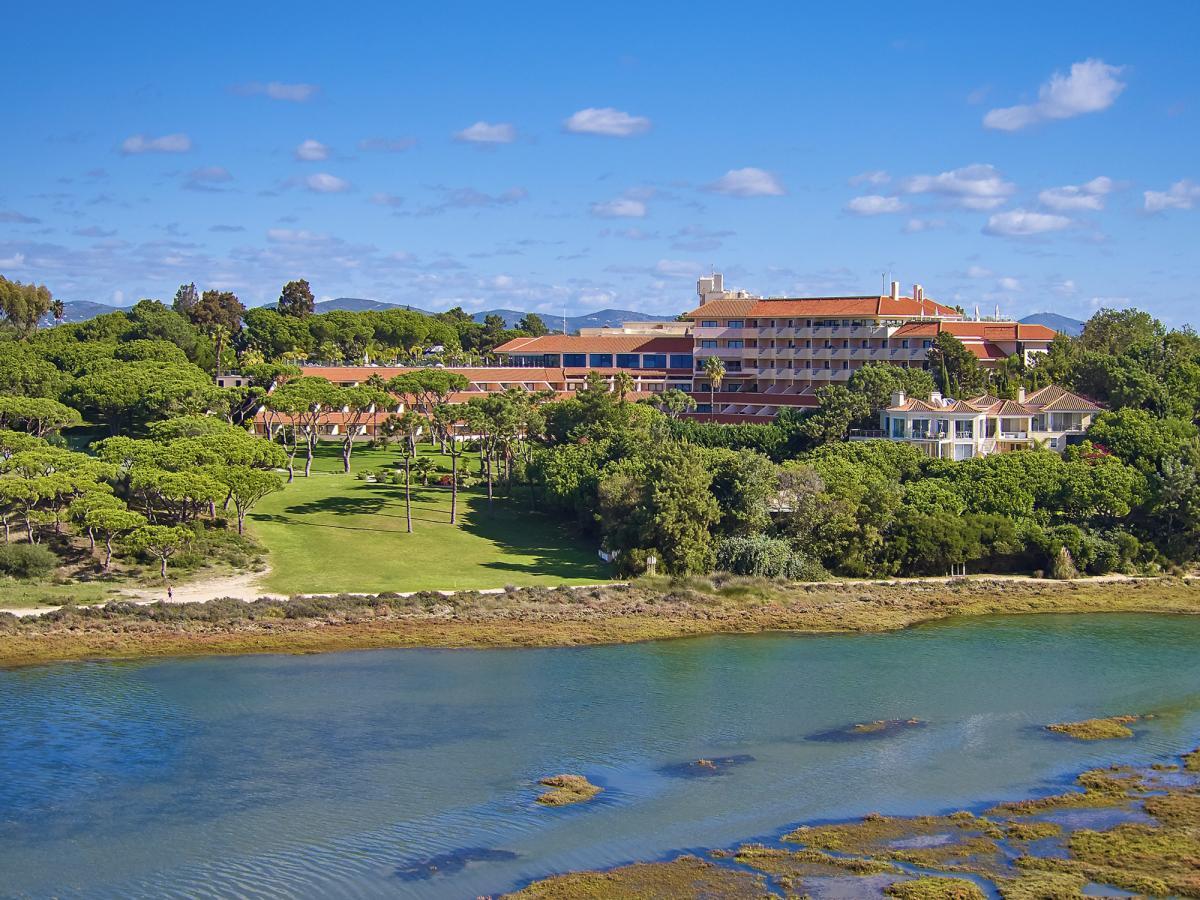 Aerial view of the hotel overlooking the lush greenery outside