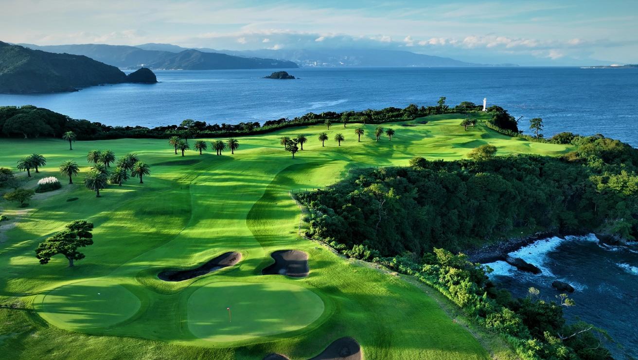 Oceanfront golf holes surrounded by lush greenery.
