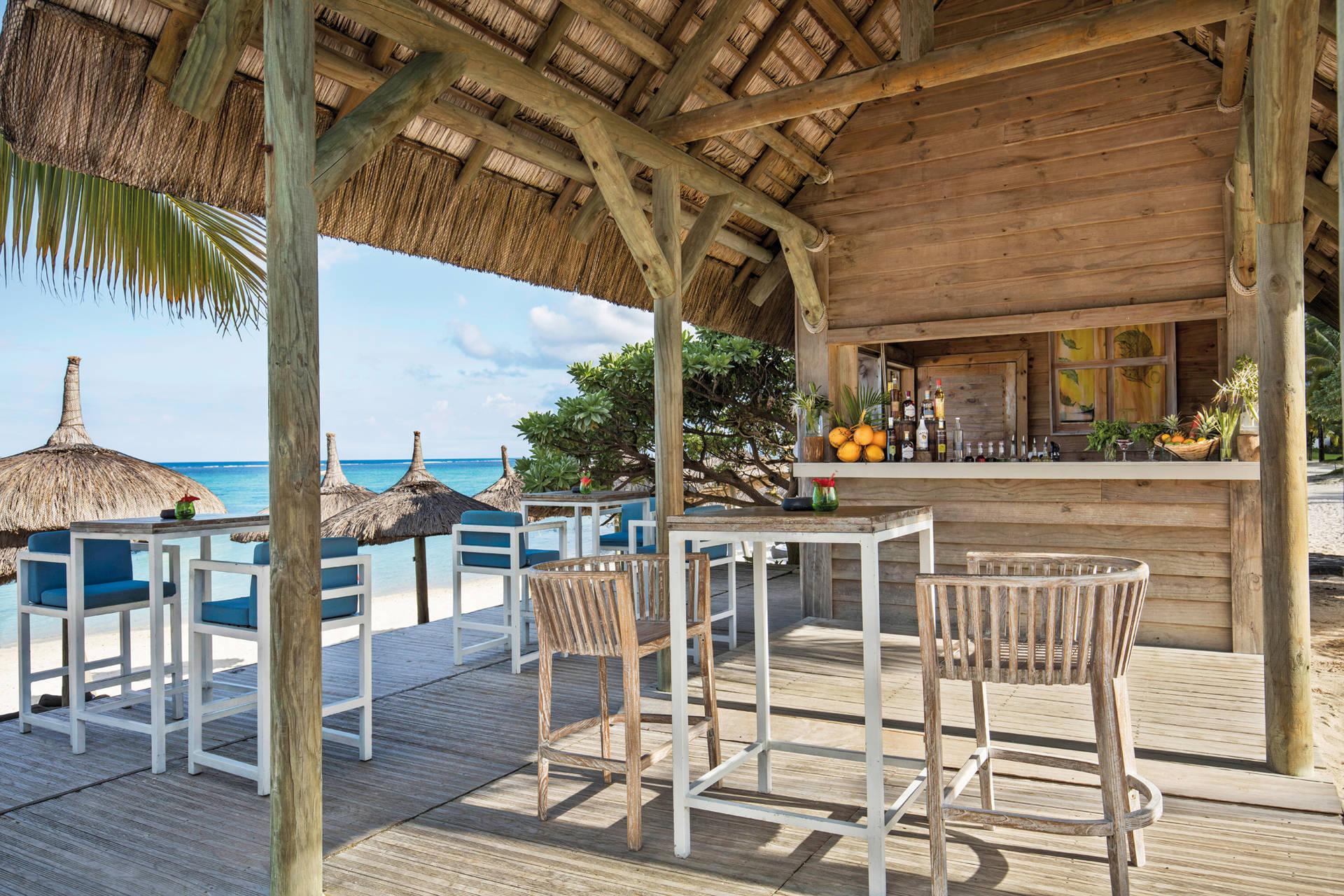 Outdoor bar space with seating and beach views