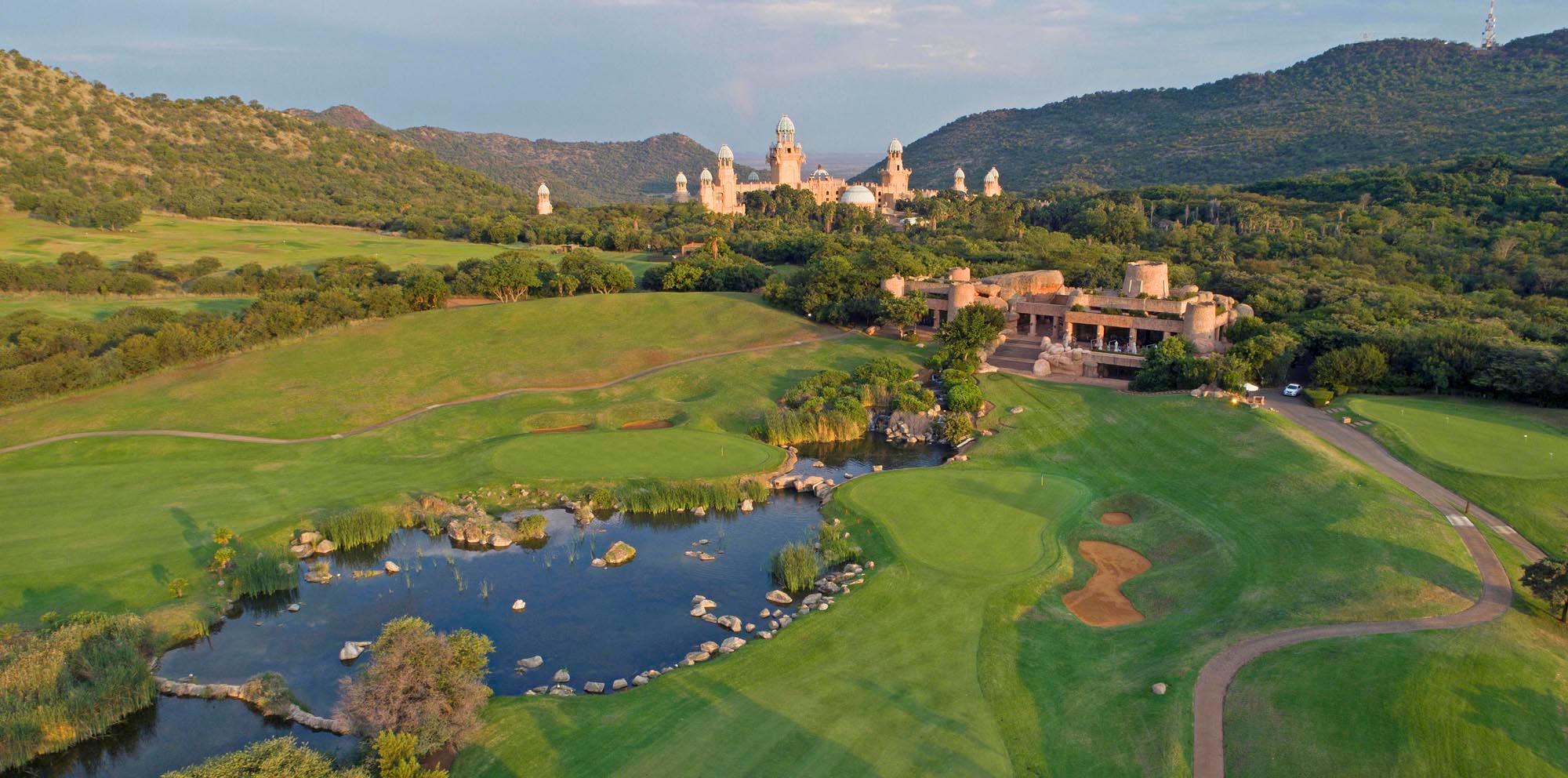 A stunning golf course view with a grand palace-like structure in the background.