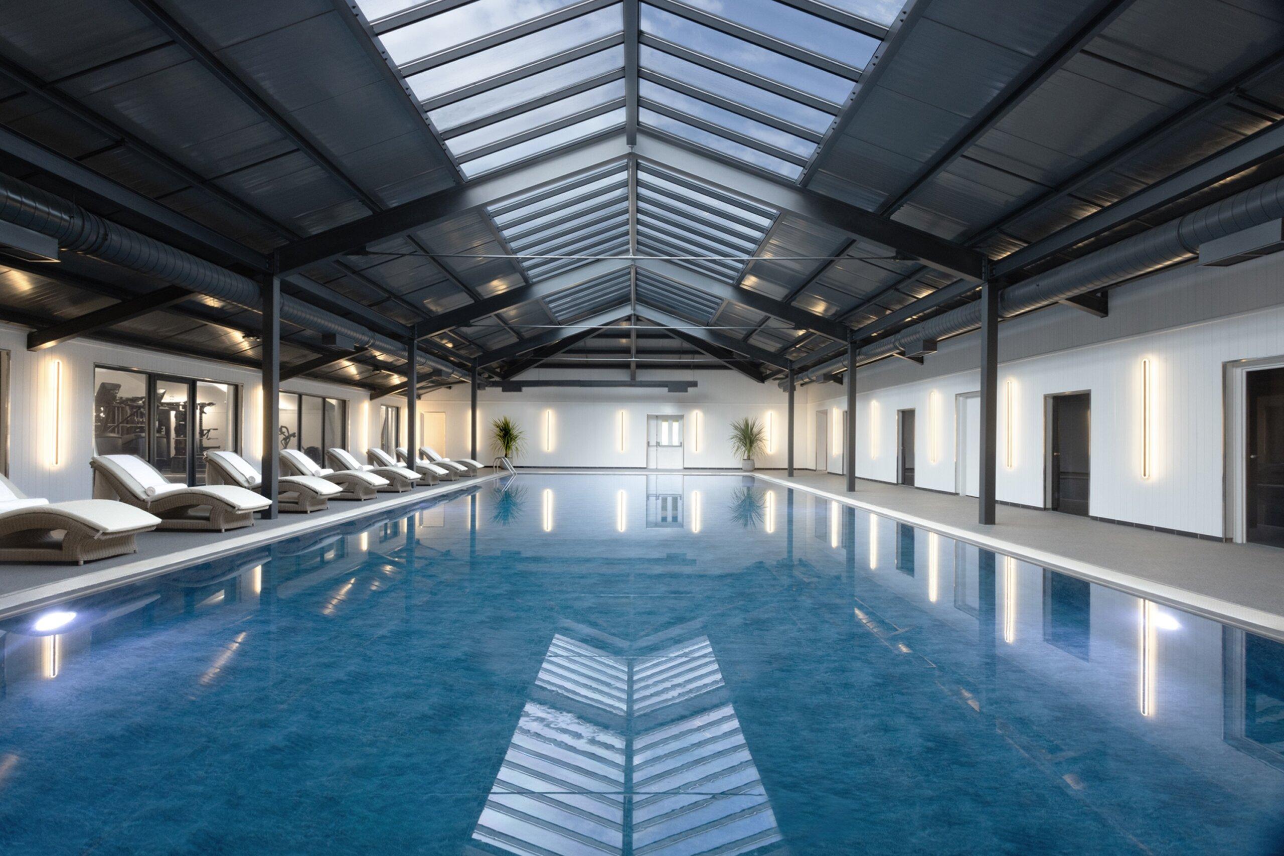 Modern indoor swimming pool and gym as part of the spa facilities at Mar Hall Golf & Spa Resort