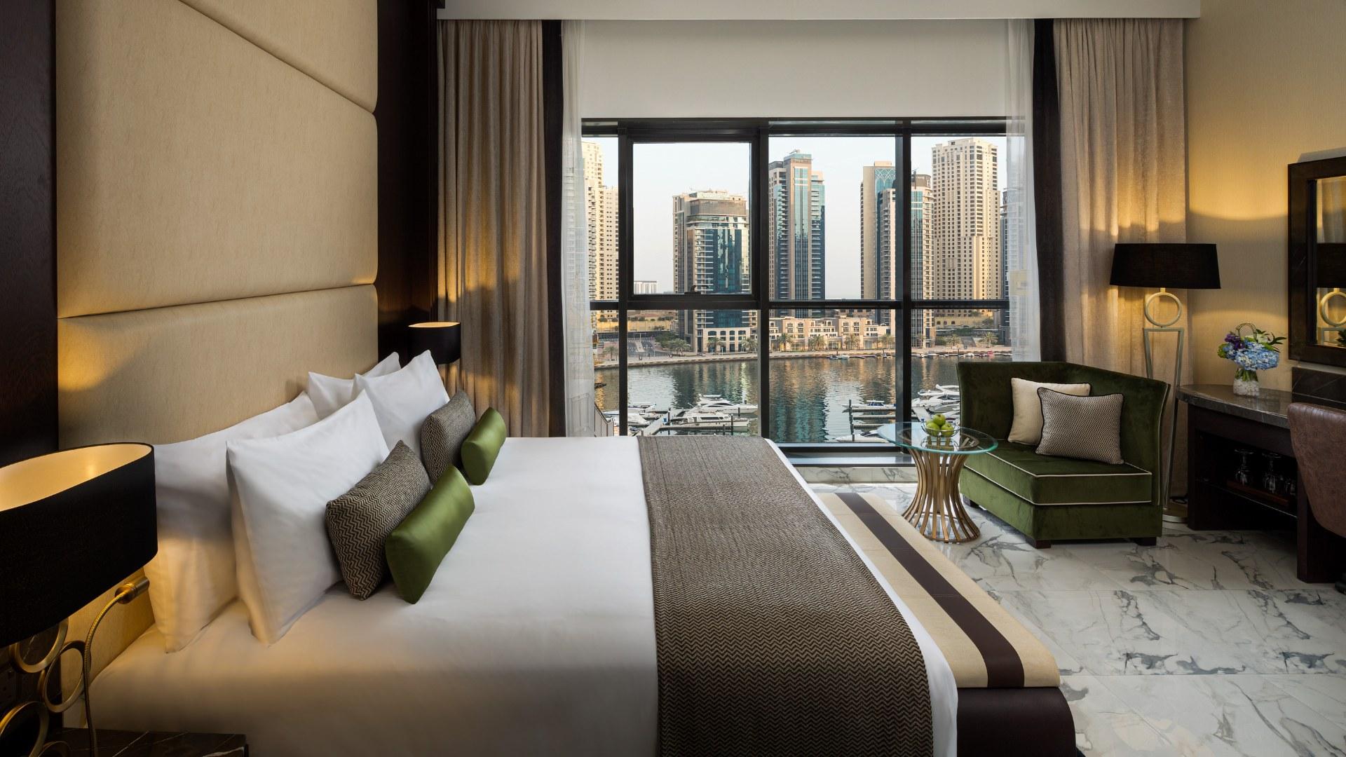 Modern Millennium Place Marina room with balcony and city view