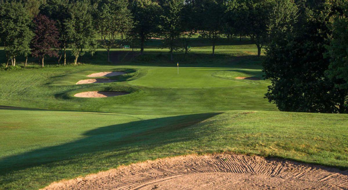Close up view of sand bunkers surrounding the green at the golf course