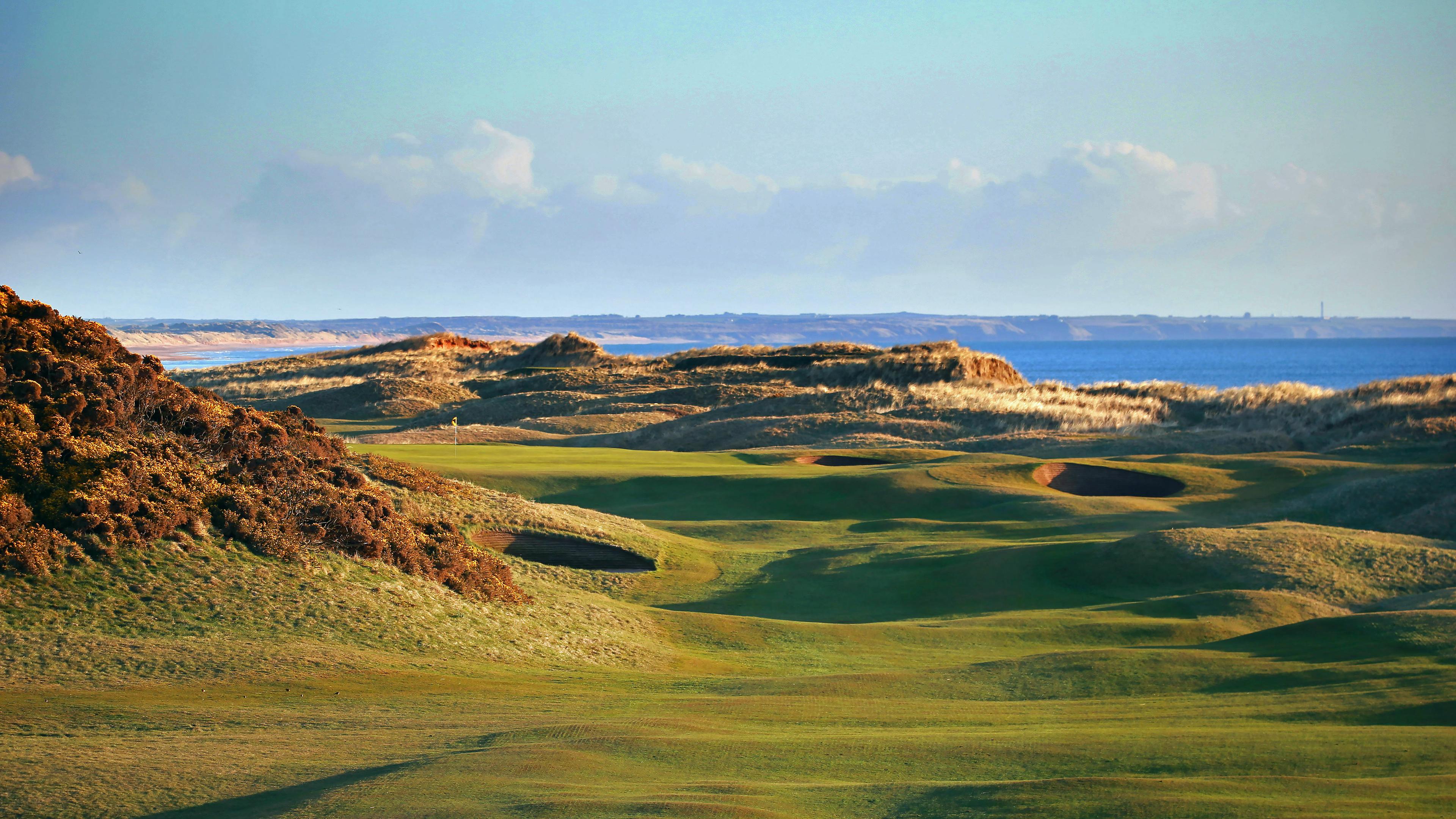 Murcur Links Gold Course with deep bunkers nestled around looking out onto the sea