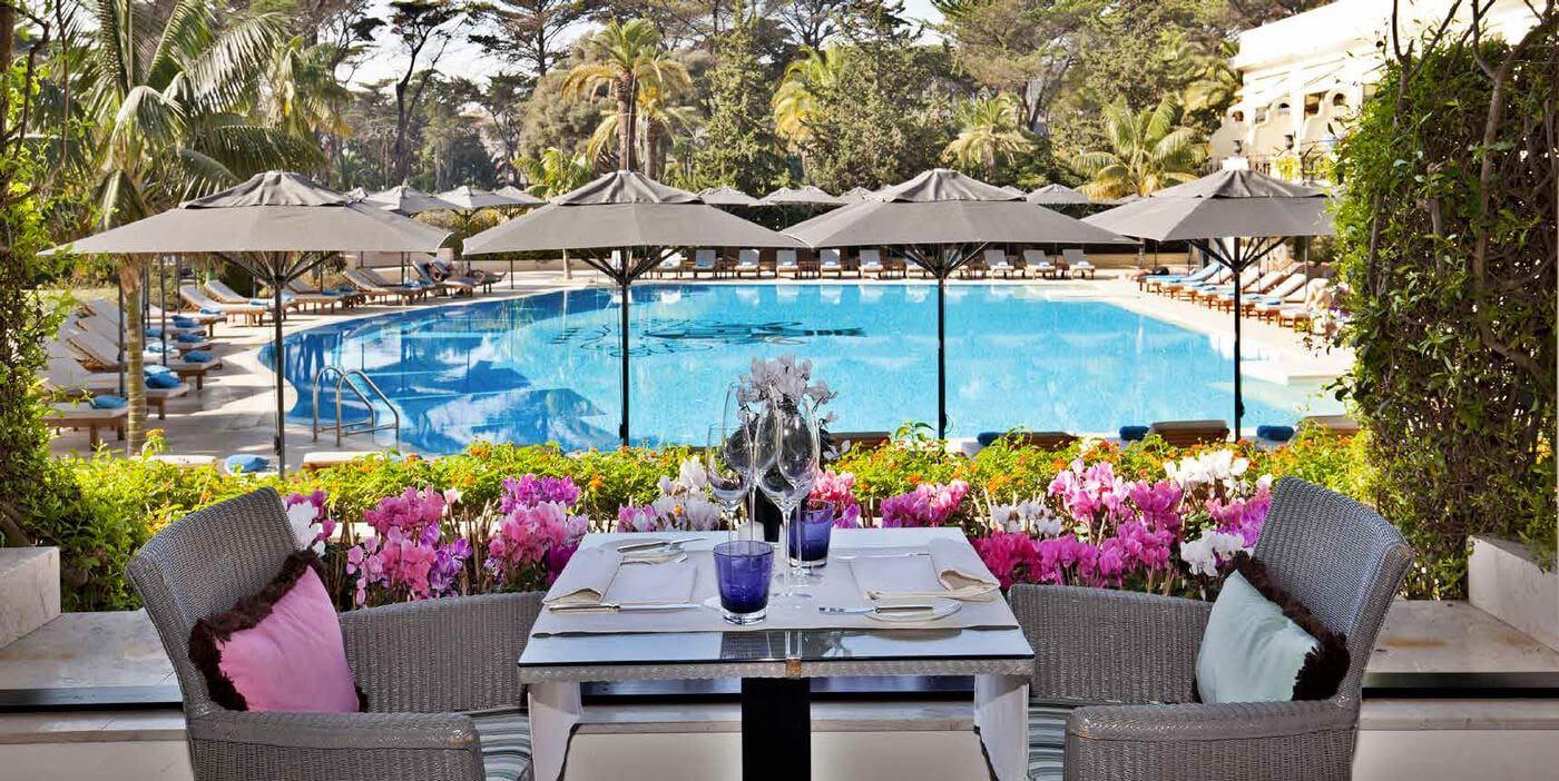 Outdoor dining area overlooking the swimming pool
