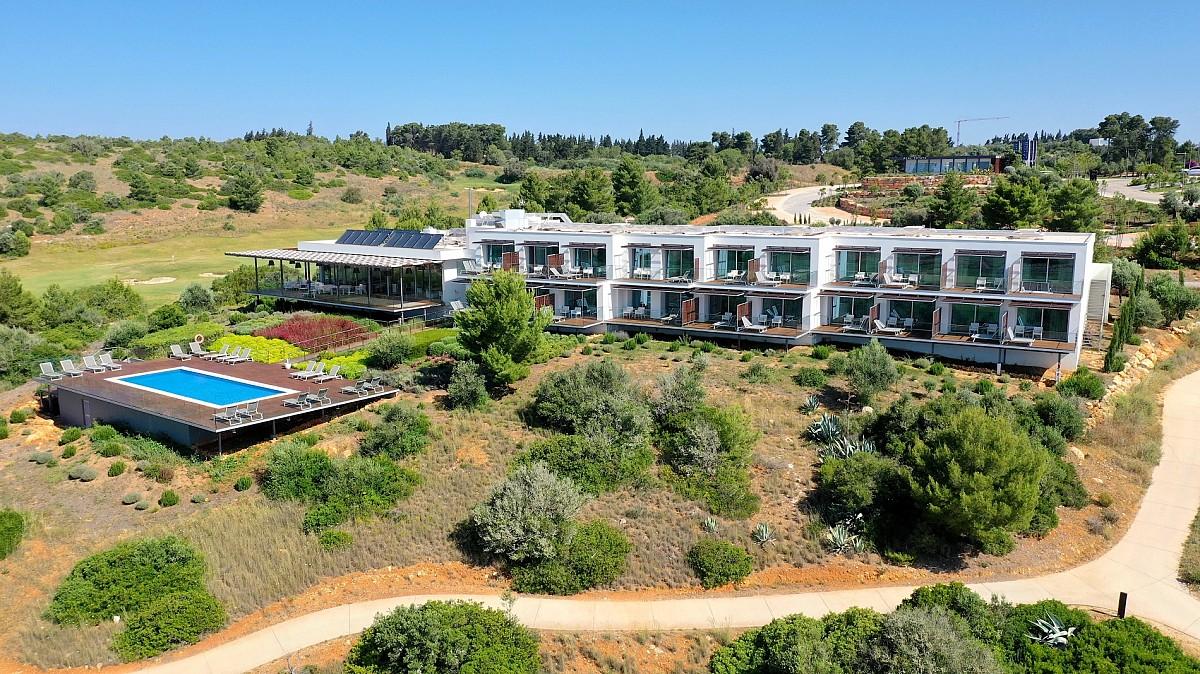 Aerial view of the Palmares Beach House Hotel with outdoor swimming pool visible