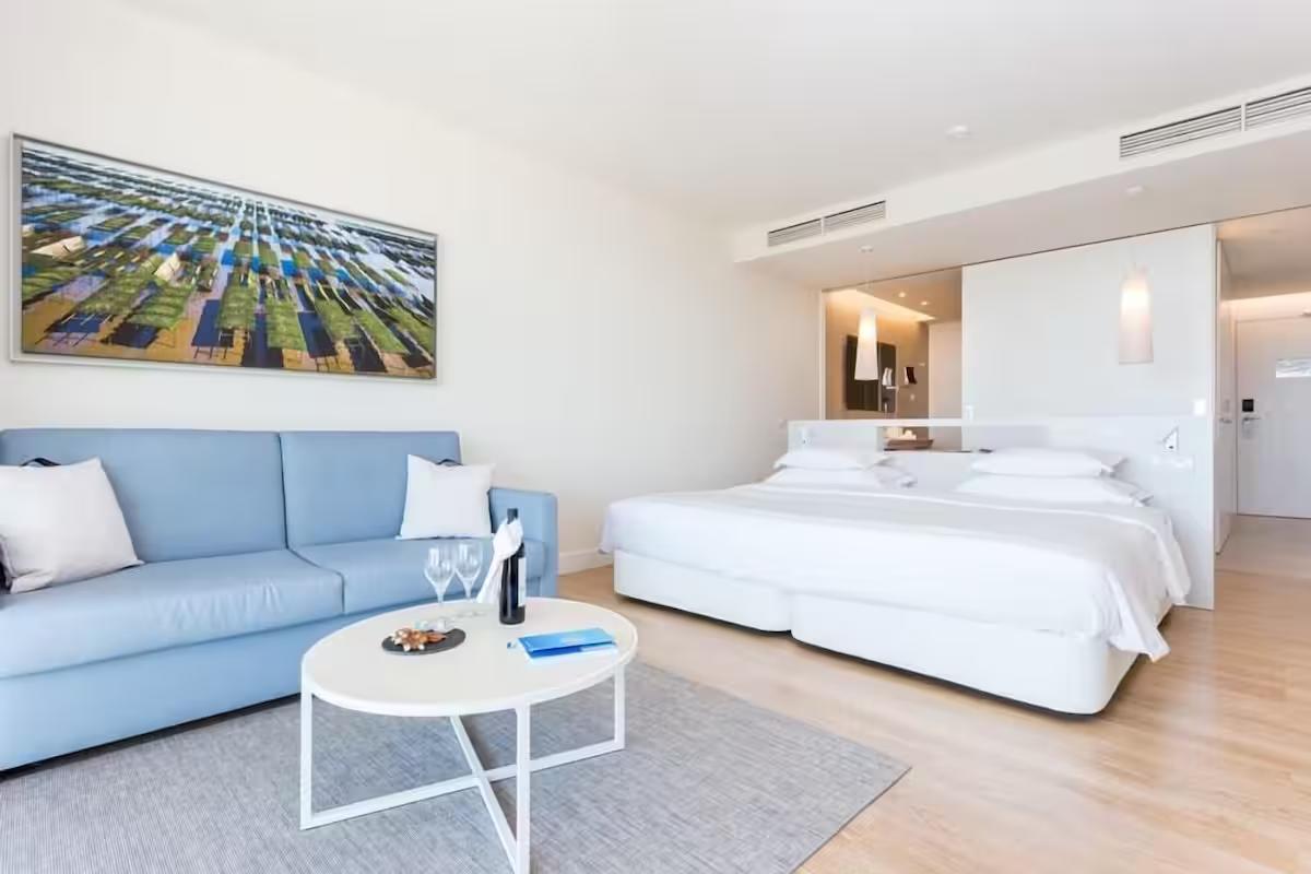 Double bed and living room area