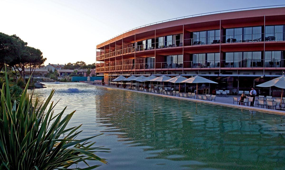 Outside view of the Pestana Vila Sol Vilamoura hotel, with outdoor dining area in view