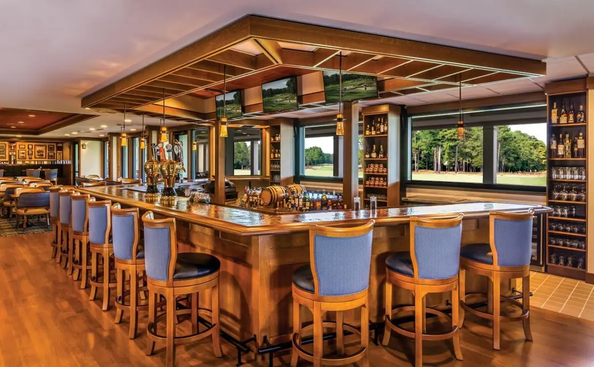 Indoor bar at the resort with a rustic look following a wooden theme