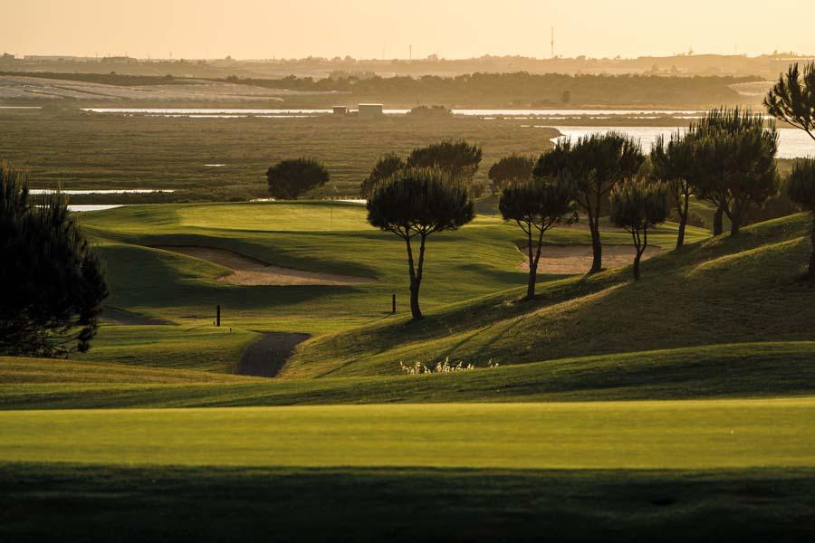 Winding fairway at sunset