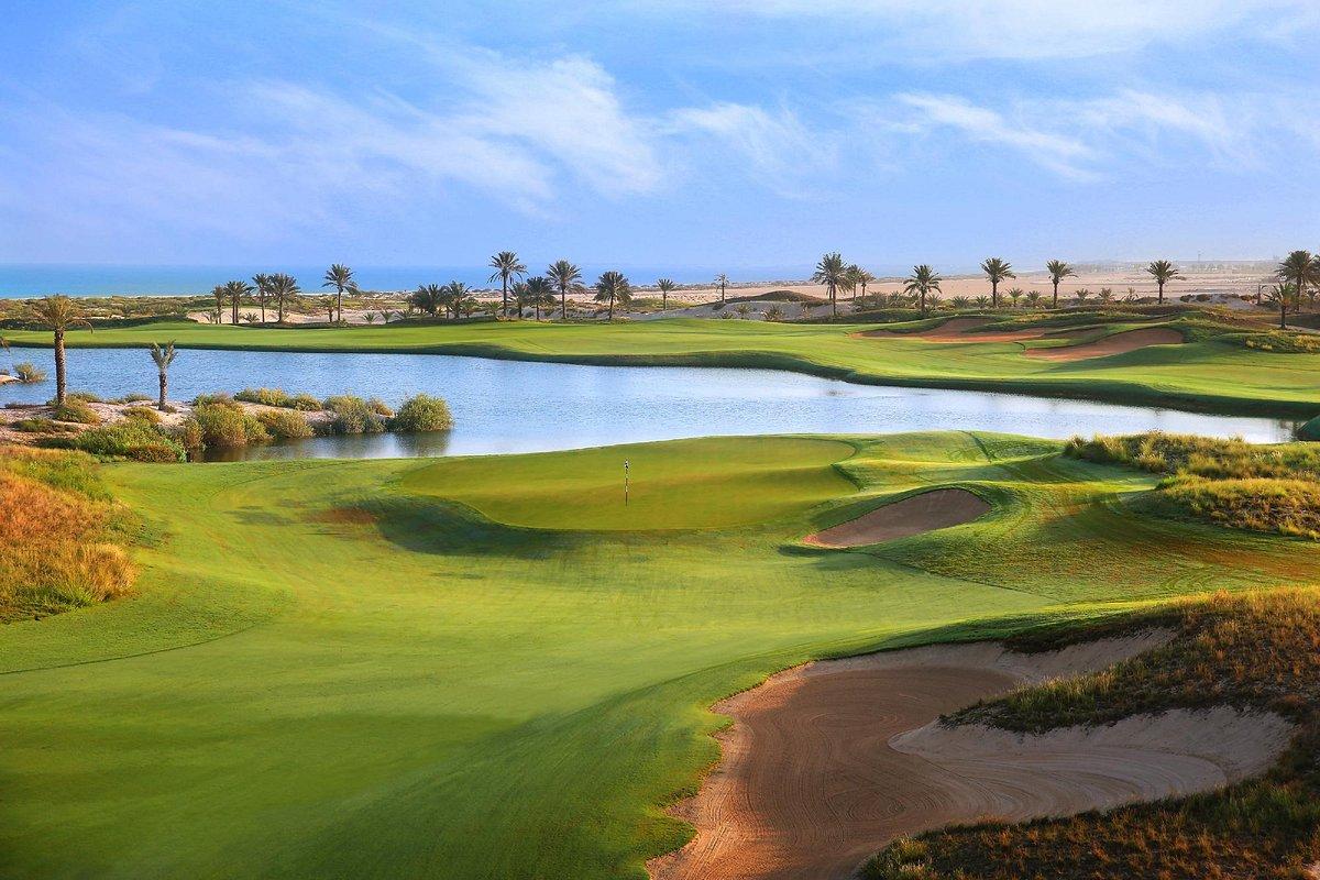 Golf fairway surrounded by water features
