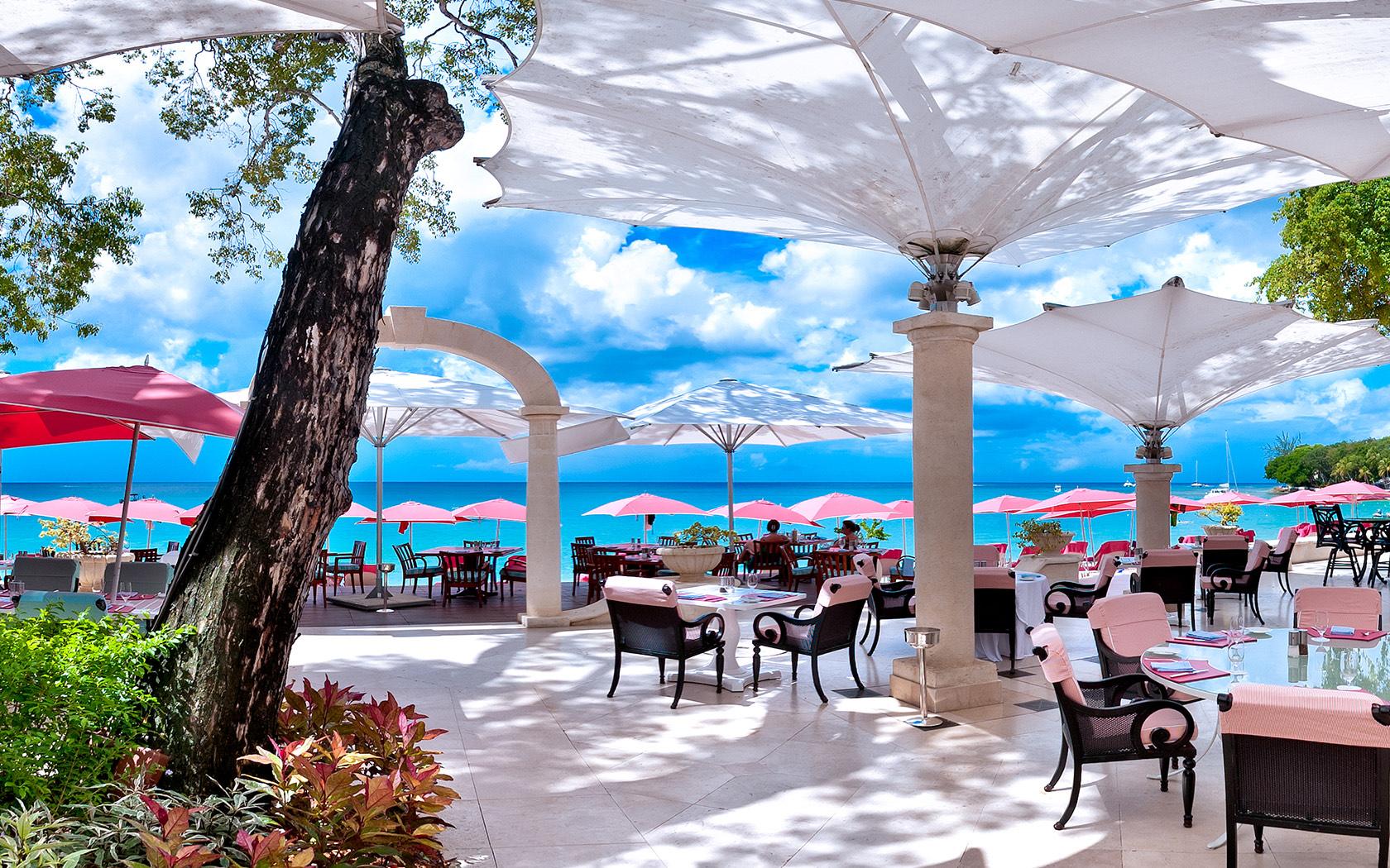 Outdoor seating area at the resort with umbrellas and sea views