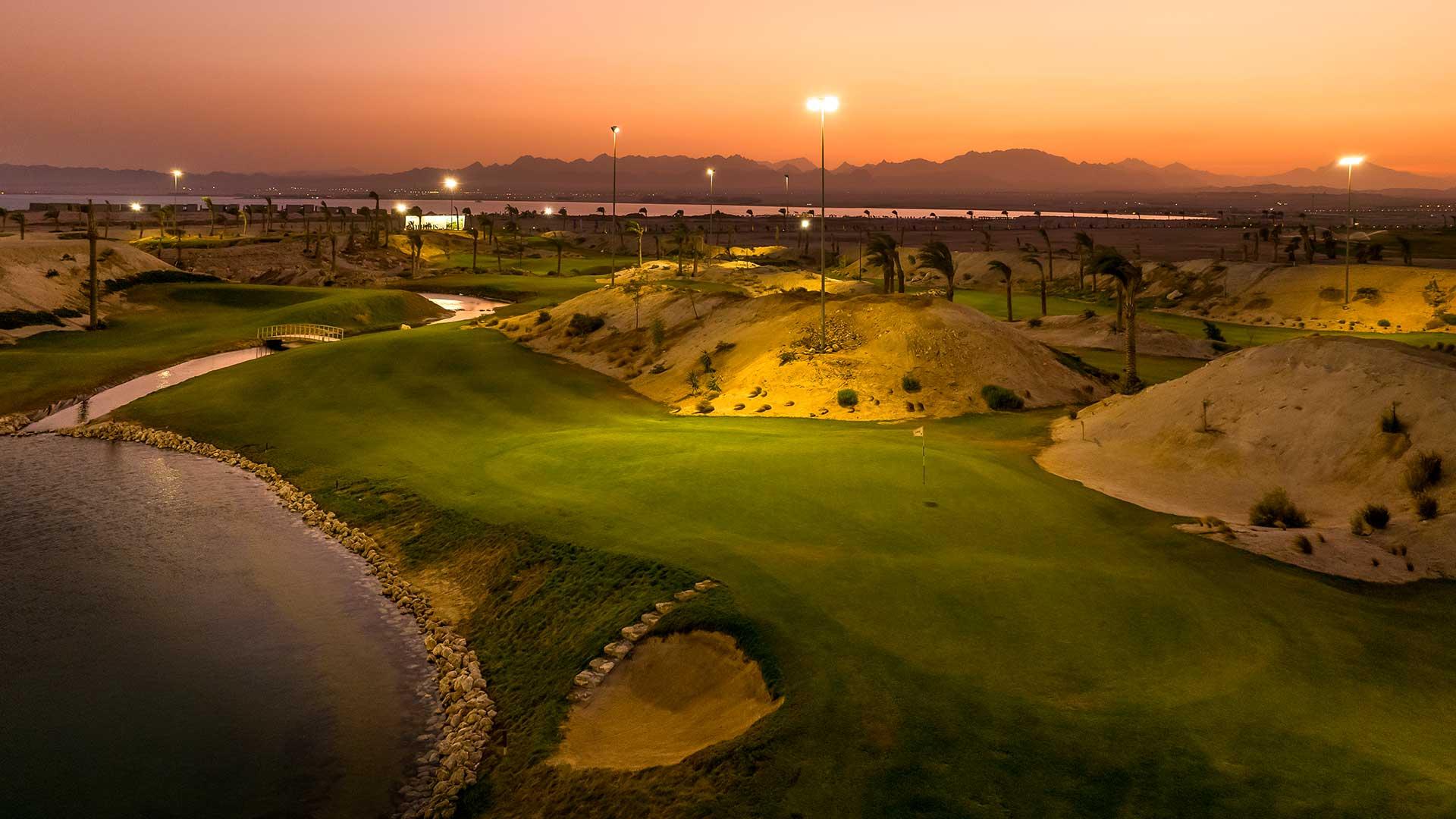 The Somabay Golf course at sunset being lit up by flood lights