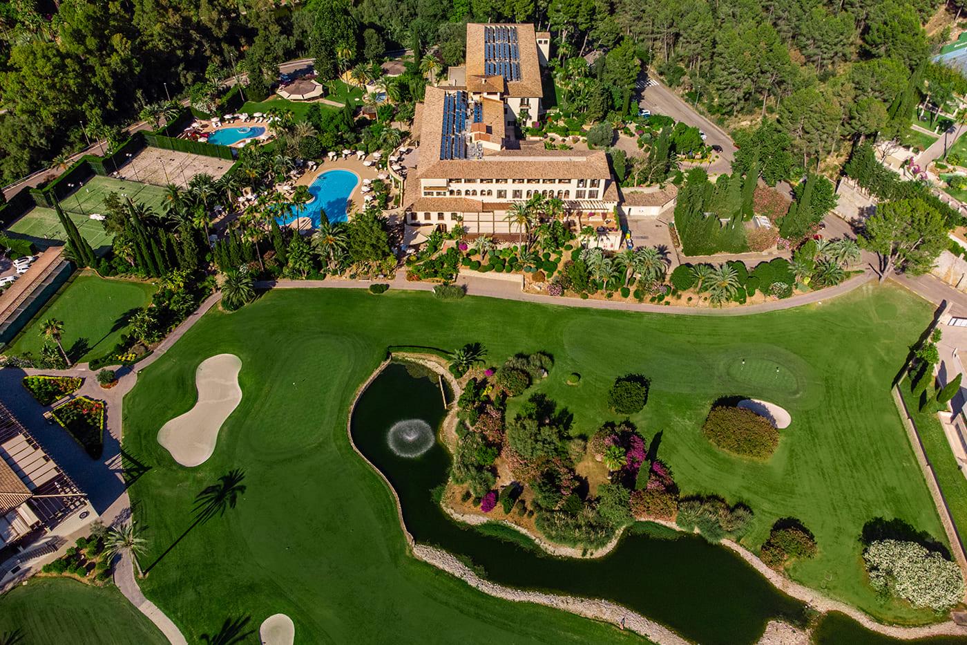 Bird's eye view of Golf Son Vida with the hotel, swimming pool and tennis courts visible