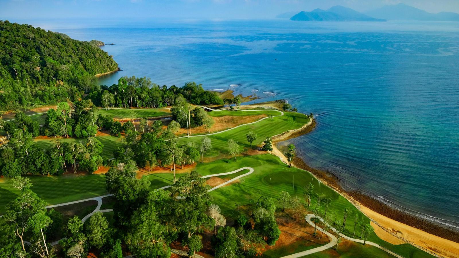 A well maintained fairway at The Els Club Teluk Datai with coastal views