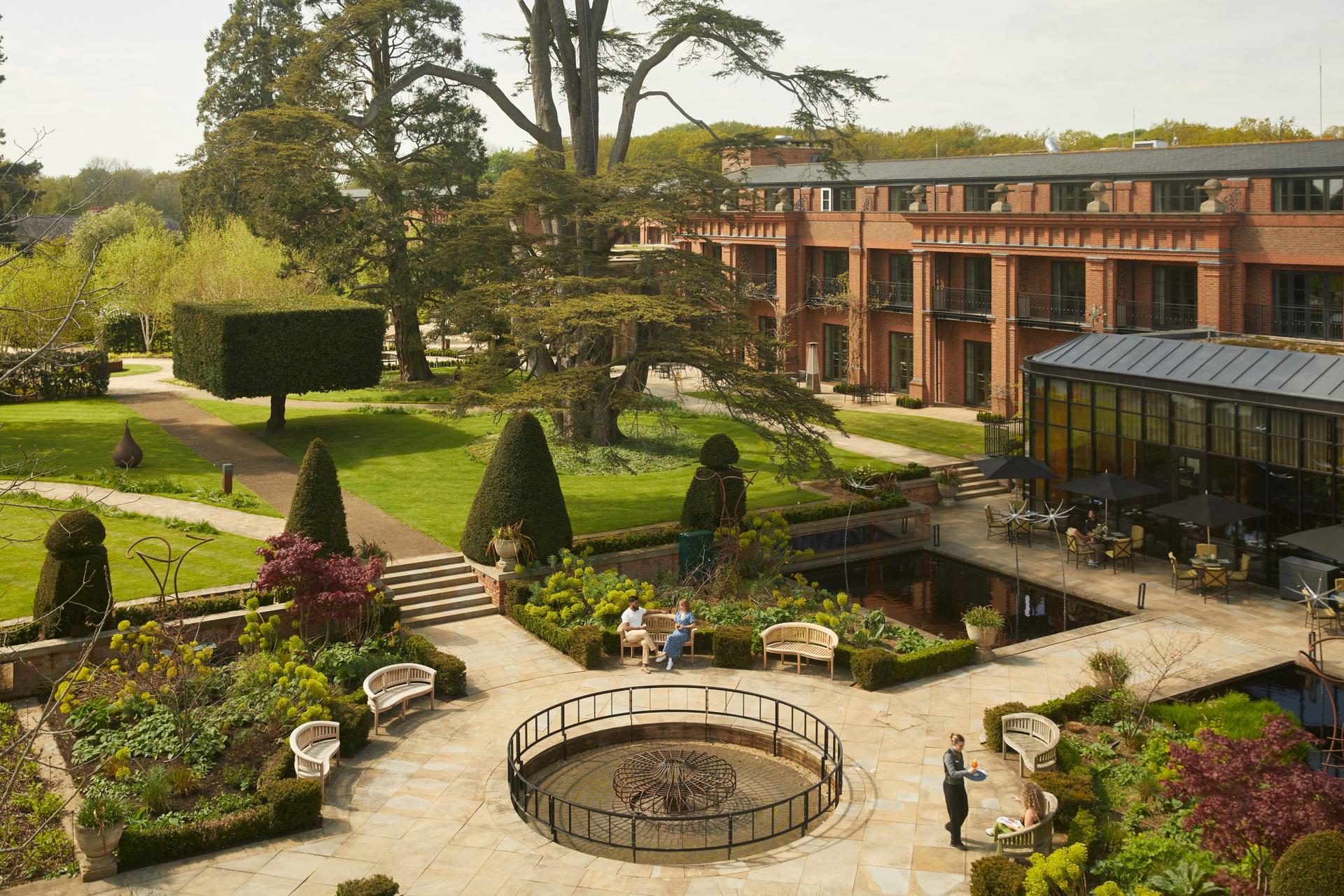 Birdseye view of people lounging in the garden at the country estate with unique nature designs