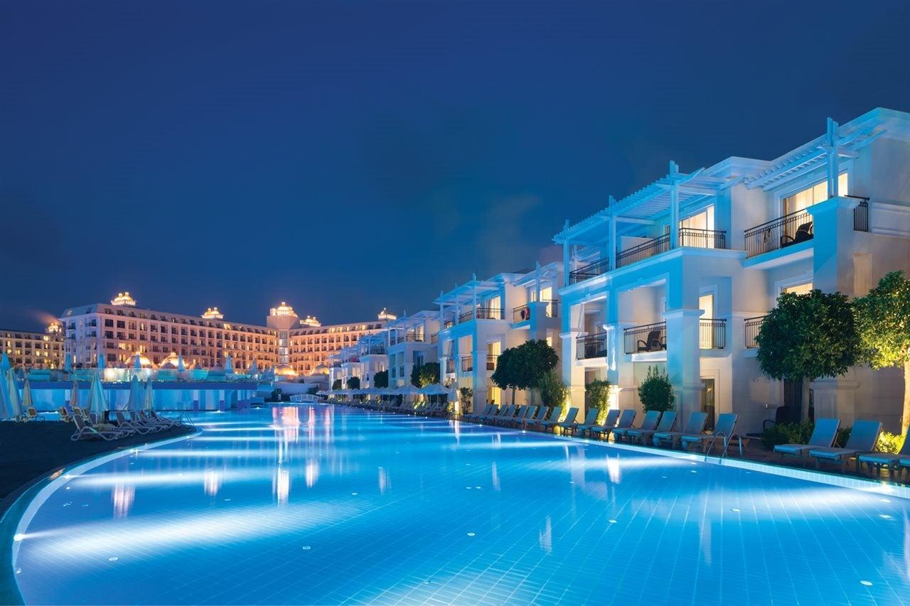 Outdoor swimming pool area at night