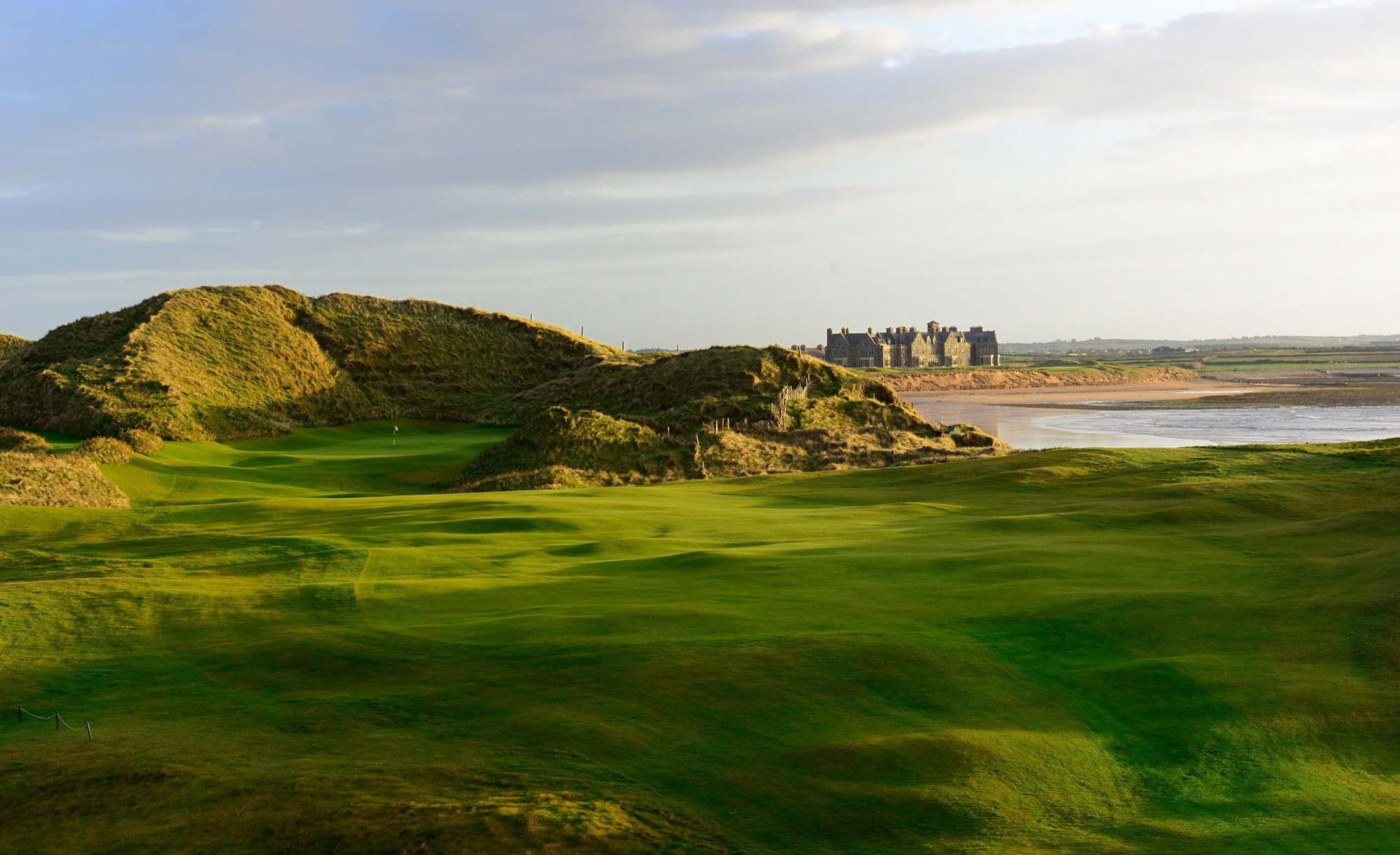 Rolling fairways lead to a stunning oceanfront view with Trump Doonbeg in the distance.