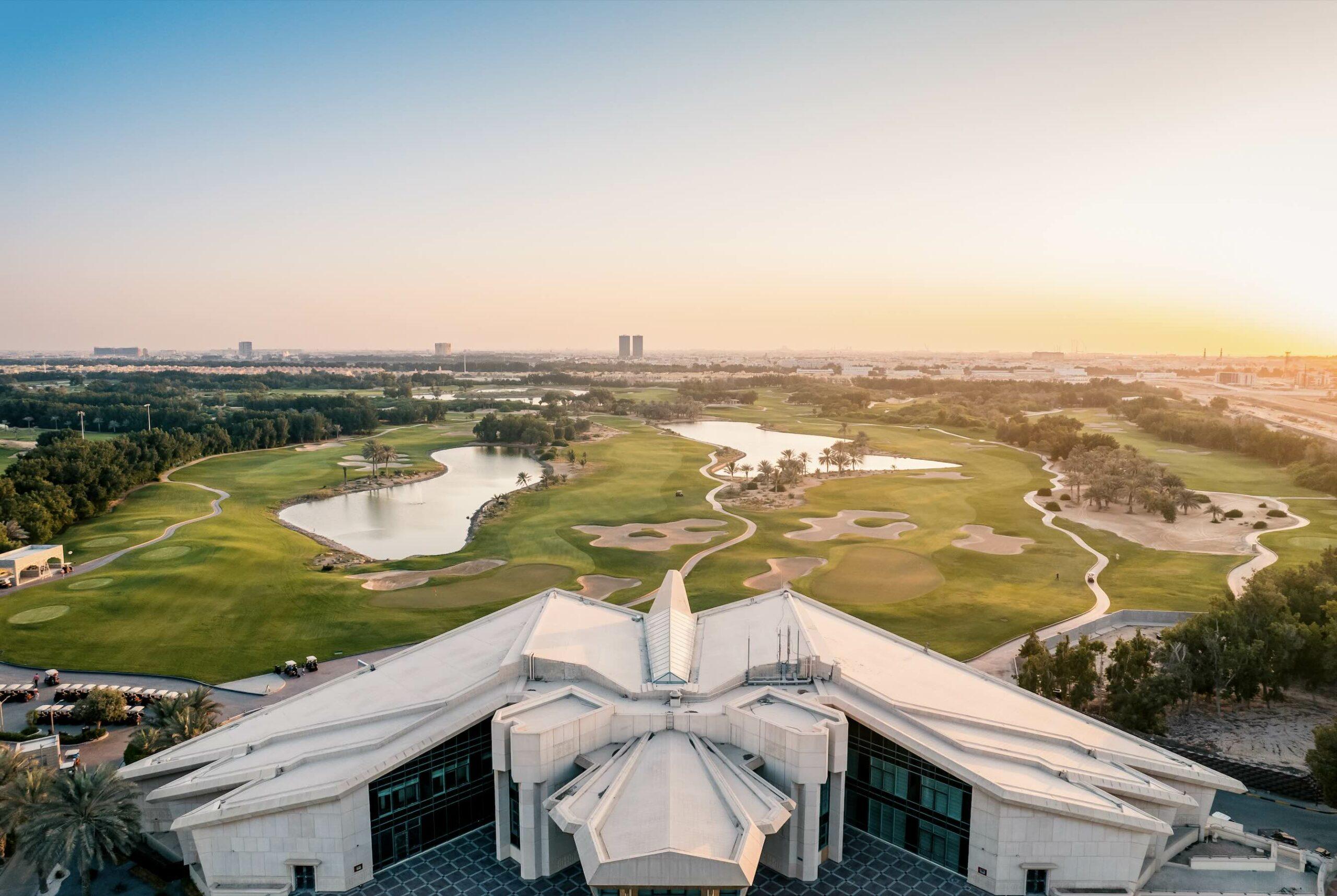 Overhead view of the VOGO Abu Dhabi Golf Resort & Spa clubhouse overlooking the golf course