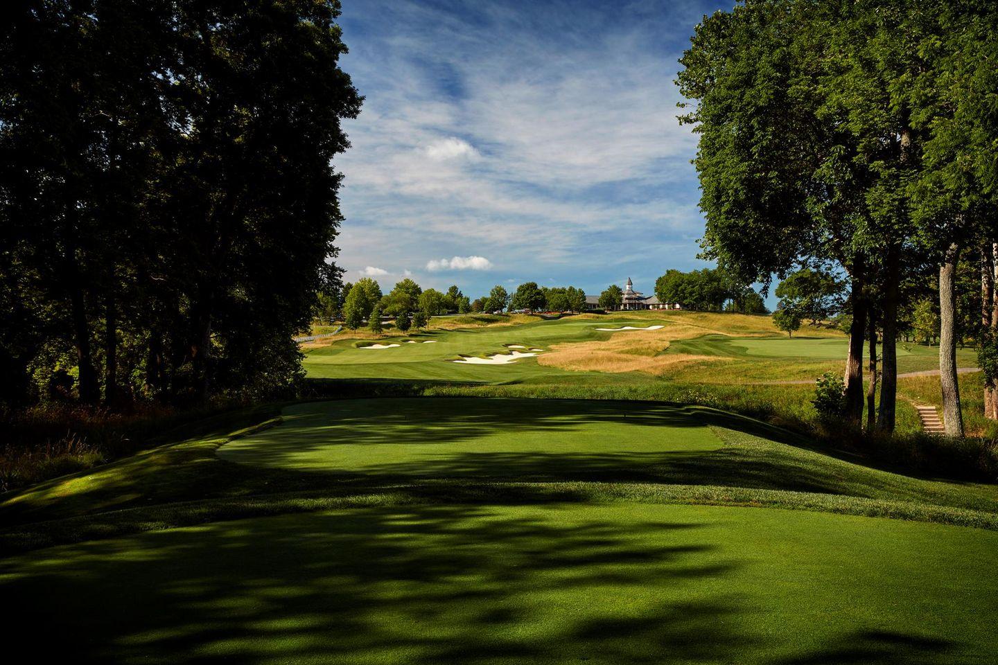 Well maintained tee off point towards wide fairways and smooth greens with the clubhouse in the distance