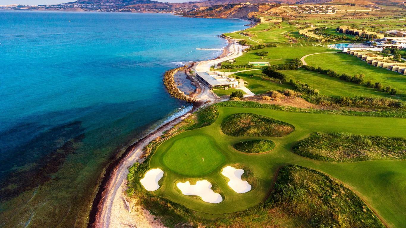 Panoramic view of the resort’s golf course and coastline, showcasing luxury and natural beauty.