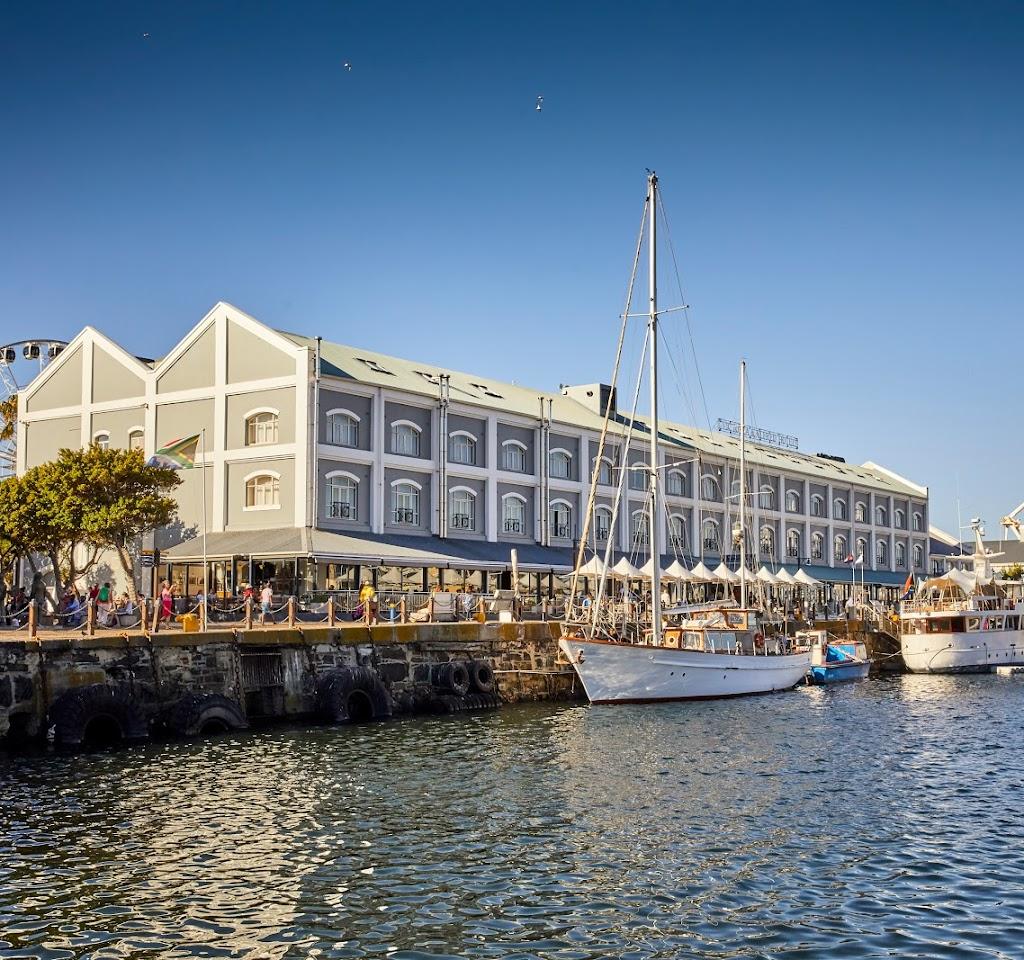 Boats docking outside of the Victoria and Alfred Hotel Waterfront