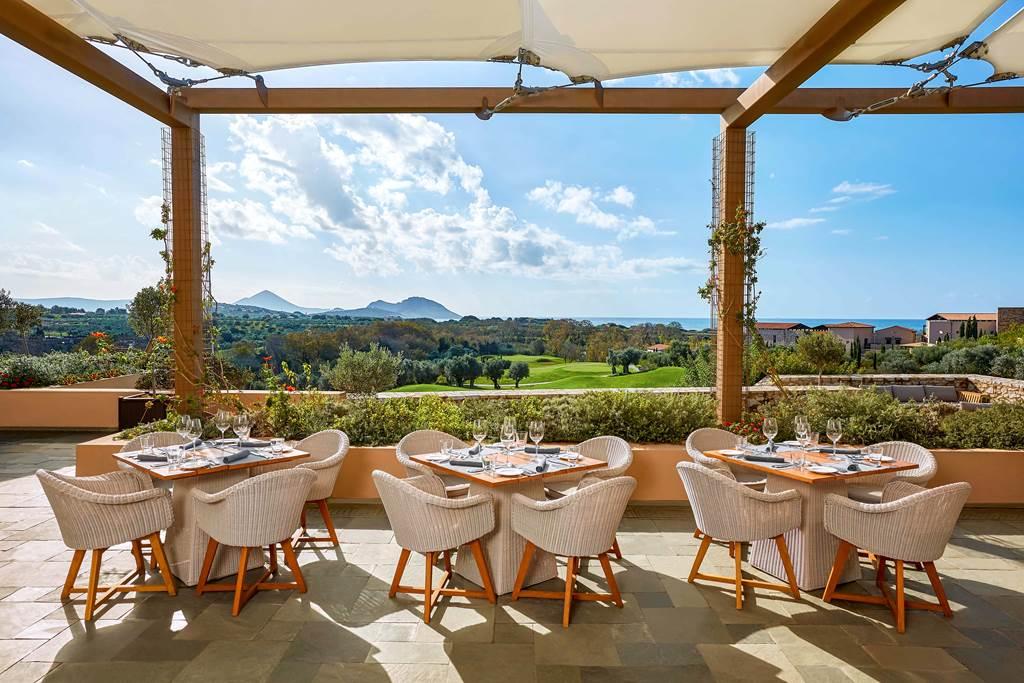 Outdoor dining area at the resort with mountain views in the distance