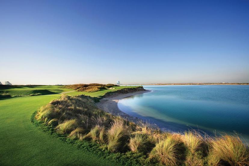 A wide fairway leading to a smooth green running along the coast