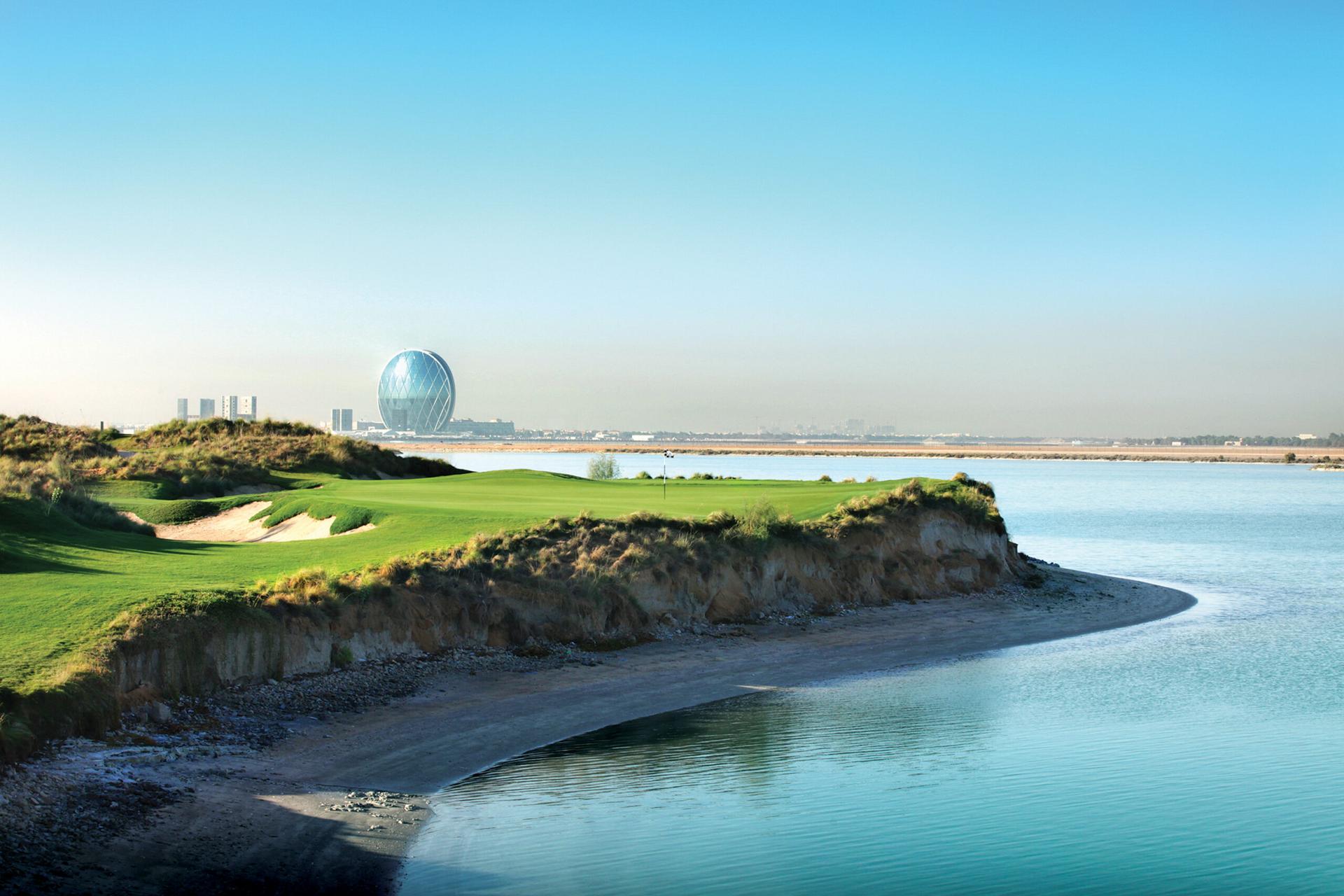 A smooth green with coastal views at the Yas Links Golf Club