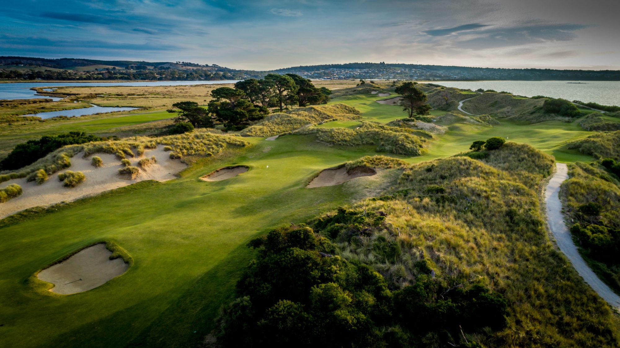 Overhead view of the Barbougle Dunes course with a smooth green surrounded by sand bunkers
