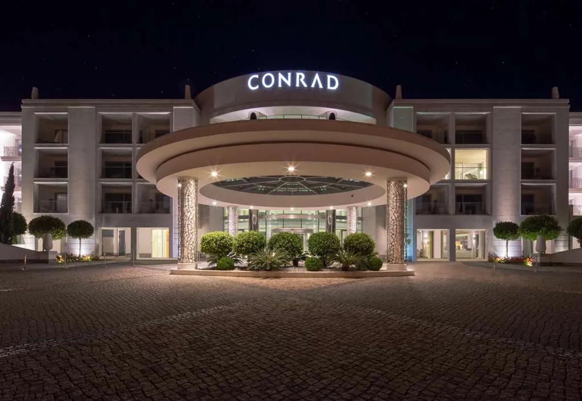 Front entrance to the Conrad Algarve with their name illuminated at the top