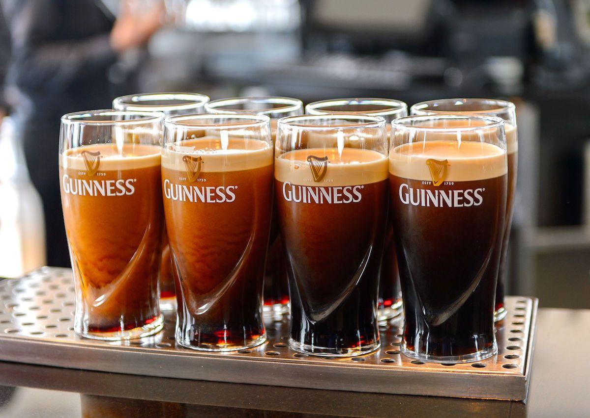 Pints of Guinness on a bar counter