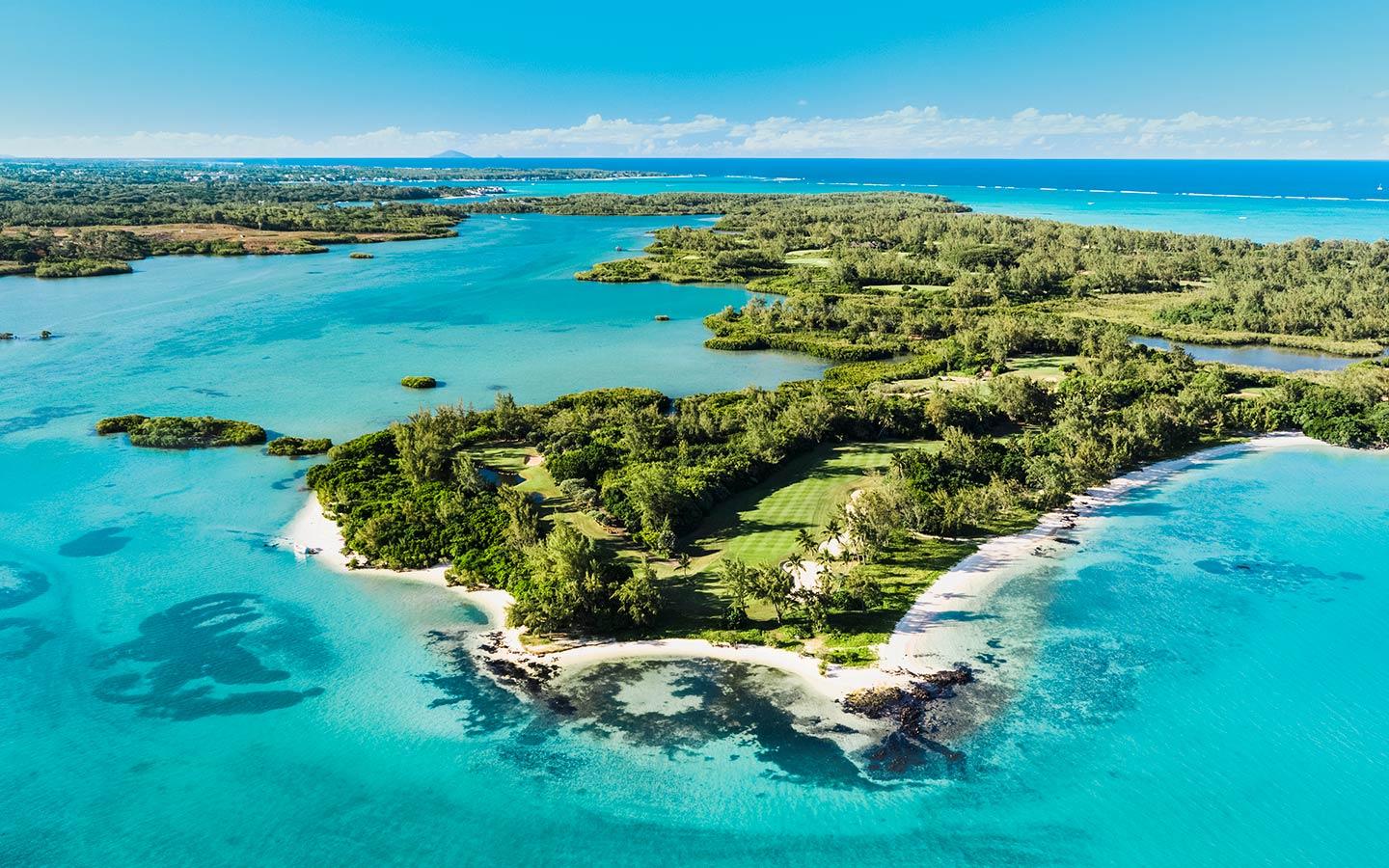 Ile Aux Cerfs from the ai, surrounded by turquoise waters