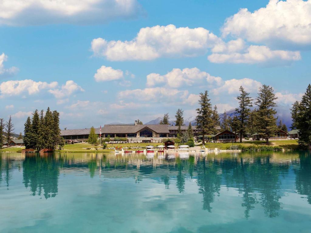 Panoramic view of the clubhouse with boats docked on the water just outside