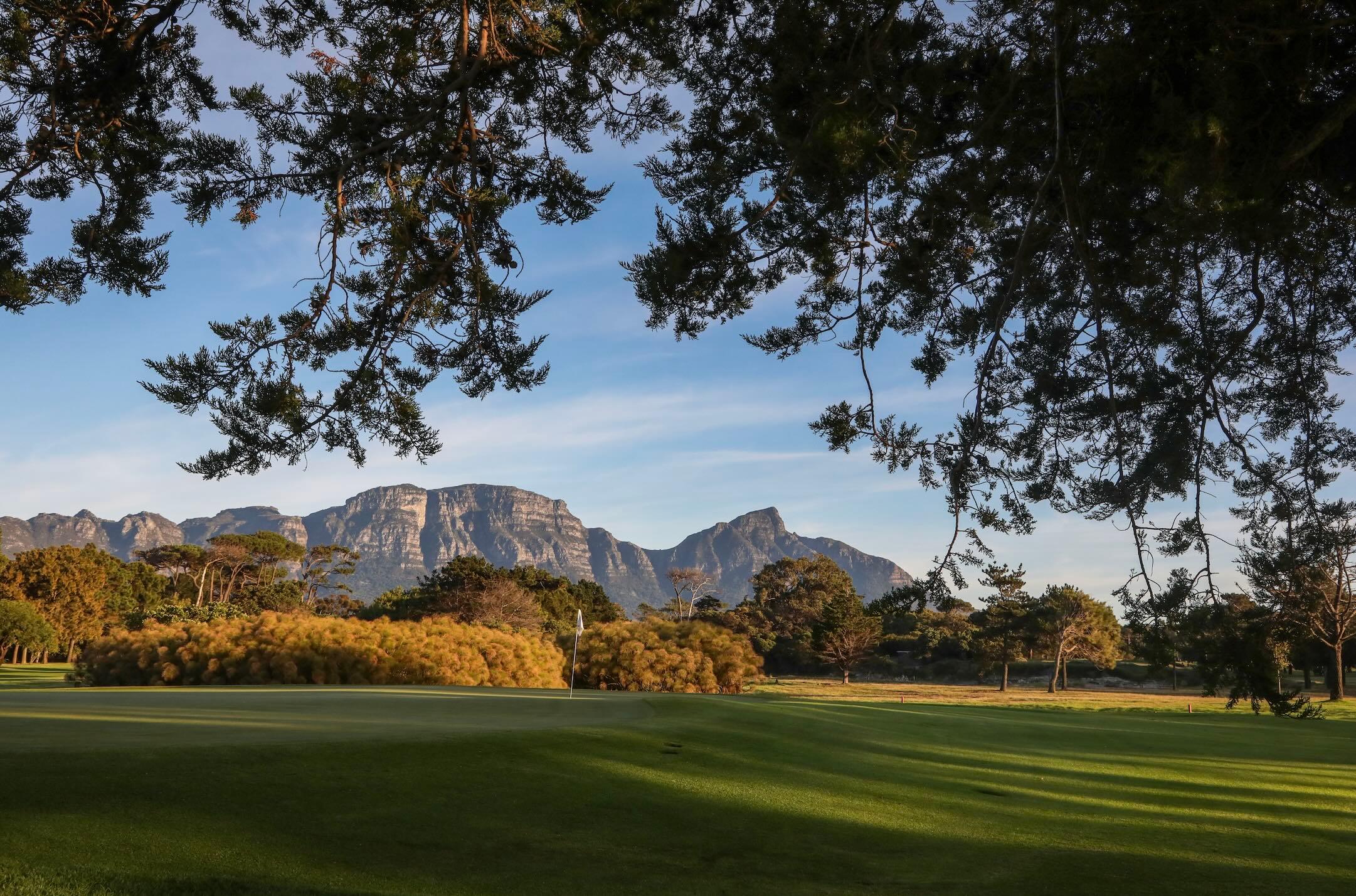 Green at Royal Cape with mountains in the background