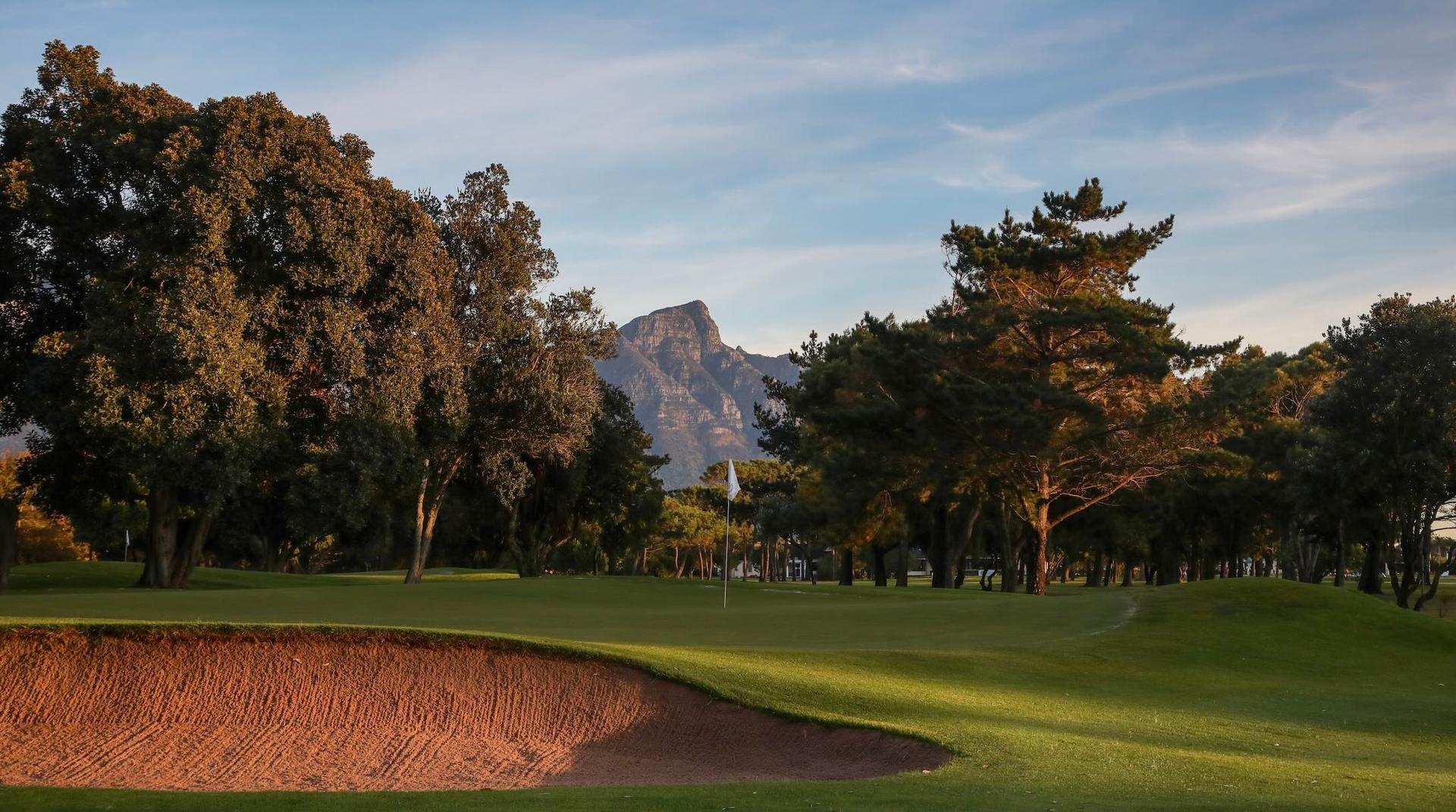 Green at Royal Cape Golf Club with mountains in the back ground