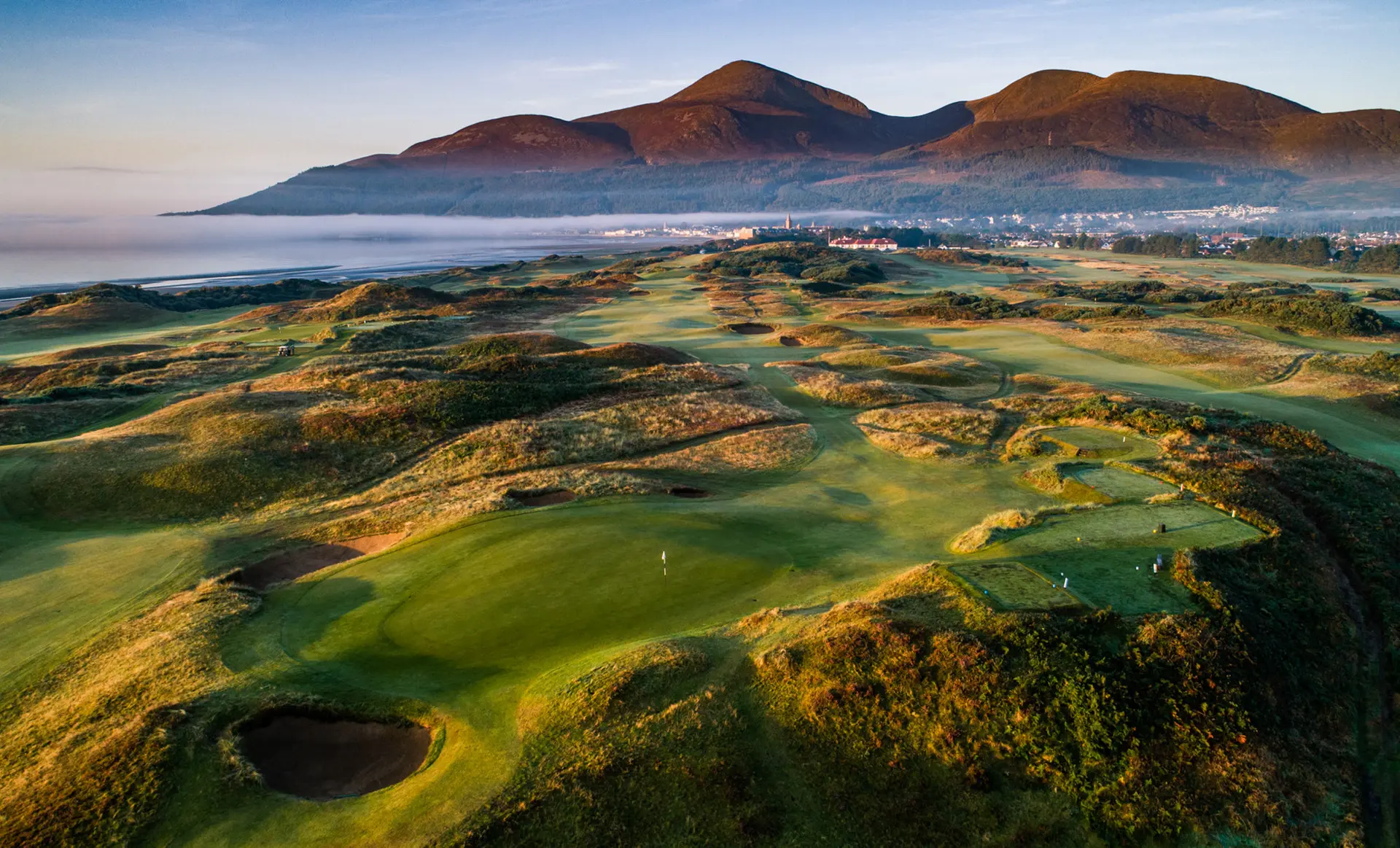 Royal County Down links golf course beneath the Mourne Mountains