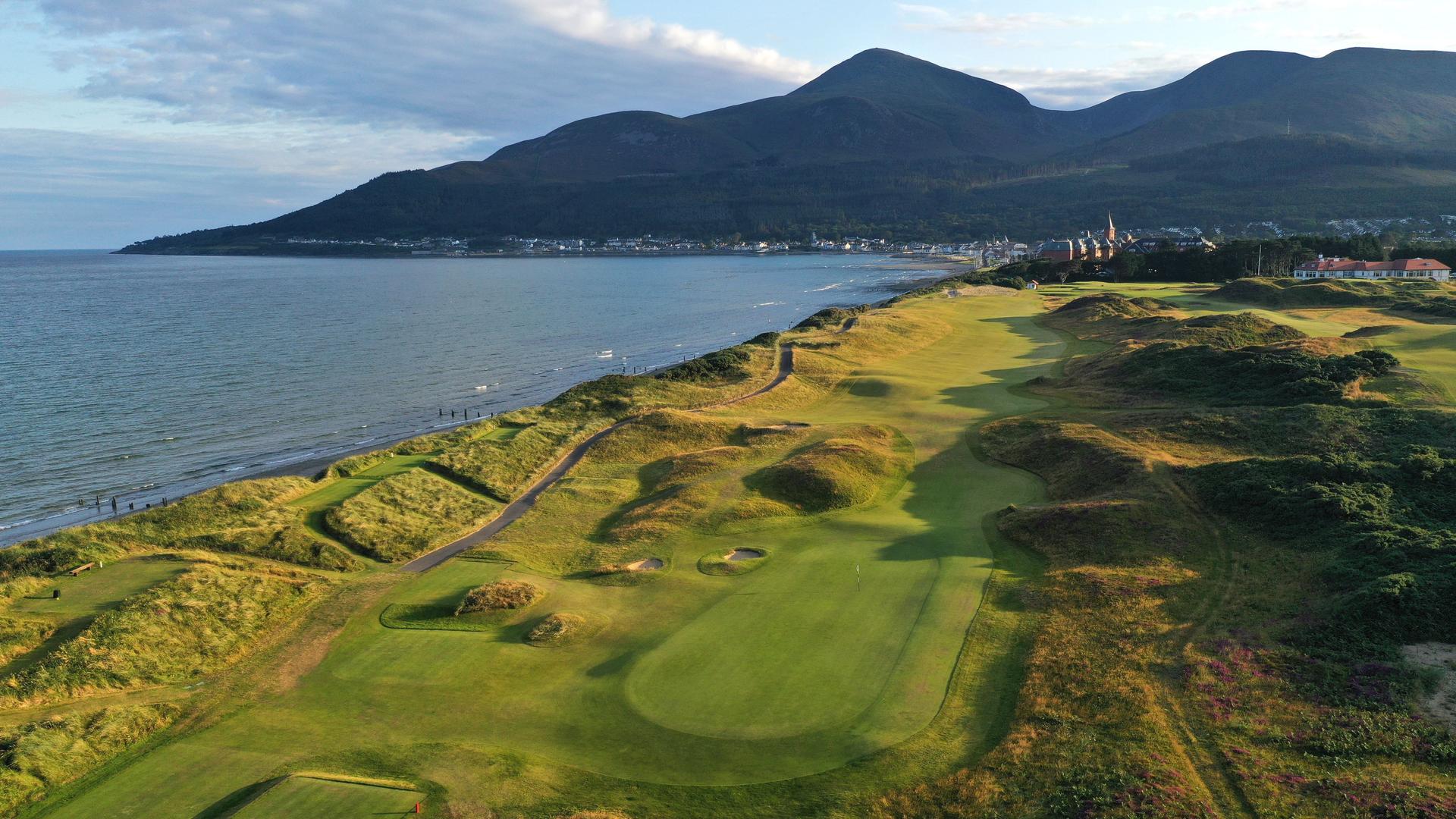 Coastal Royal County Down course with mountain backdrop in Ireland
