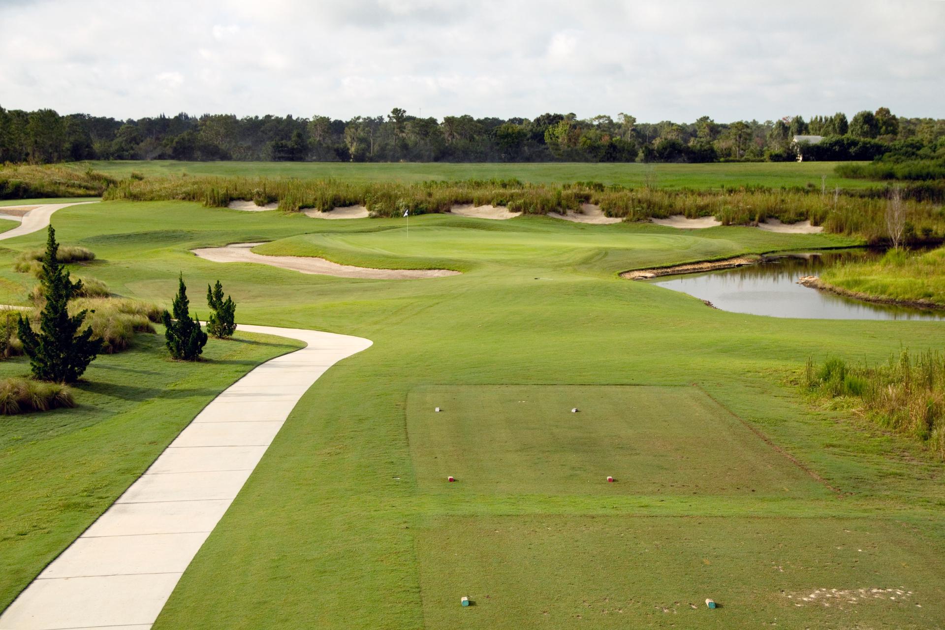 Tee box leading to a manicured green