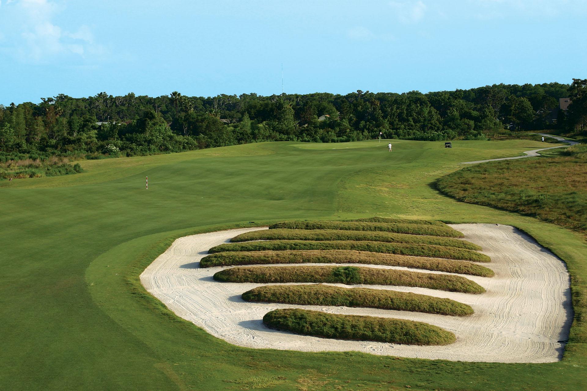 A unique sand bunker under clear blue skies