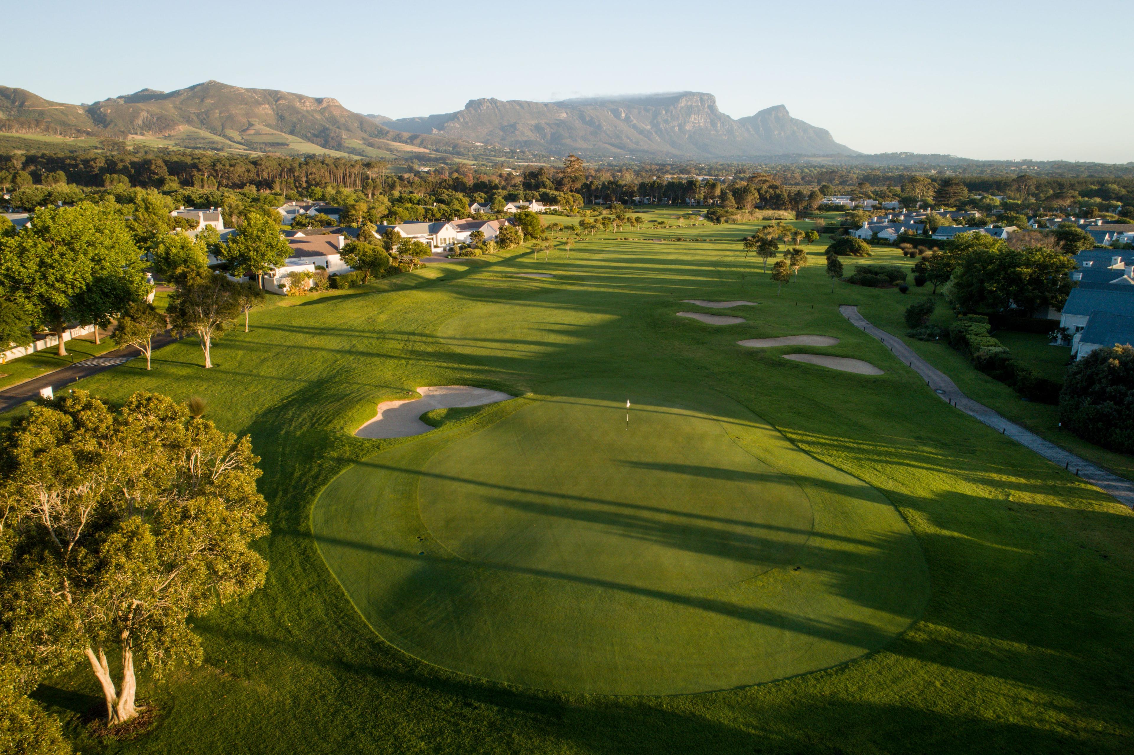 Aerial view of Steenberg Golf Club with mountains in the background