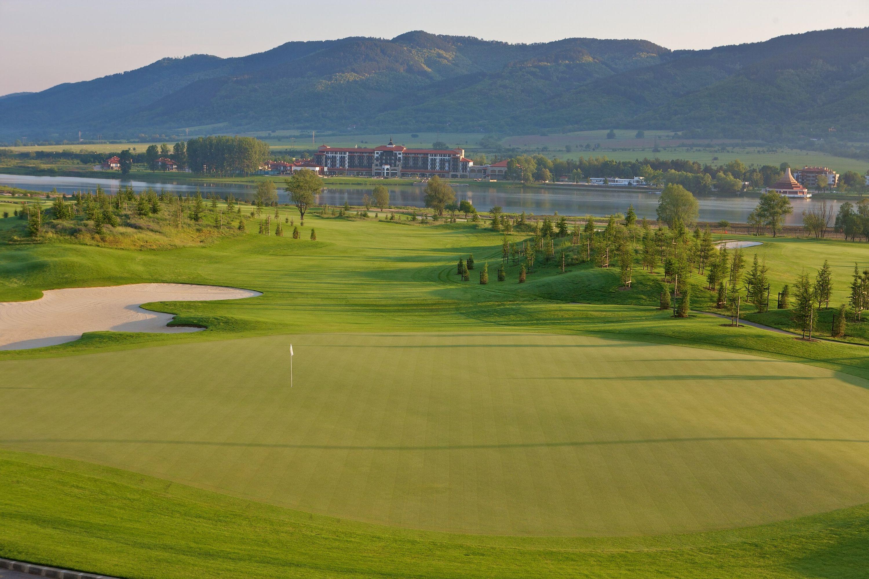 Overhead view of a manicured fairway leading to a smooth green