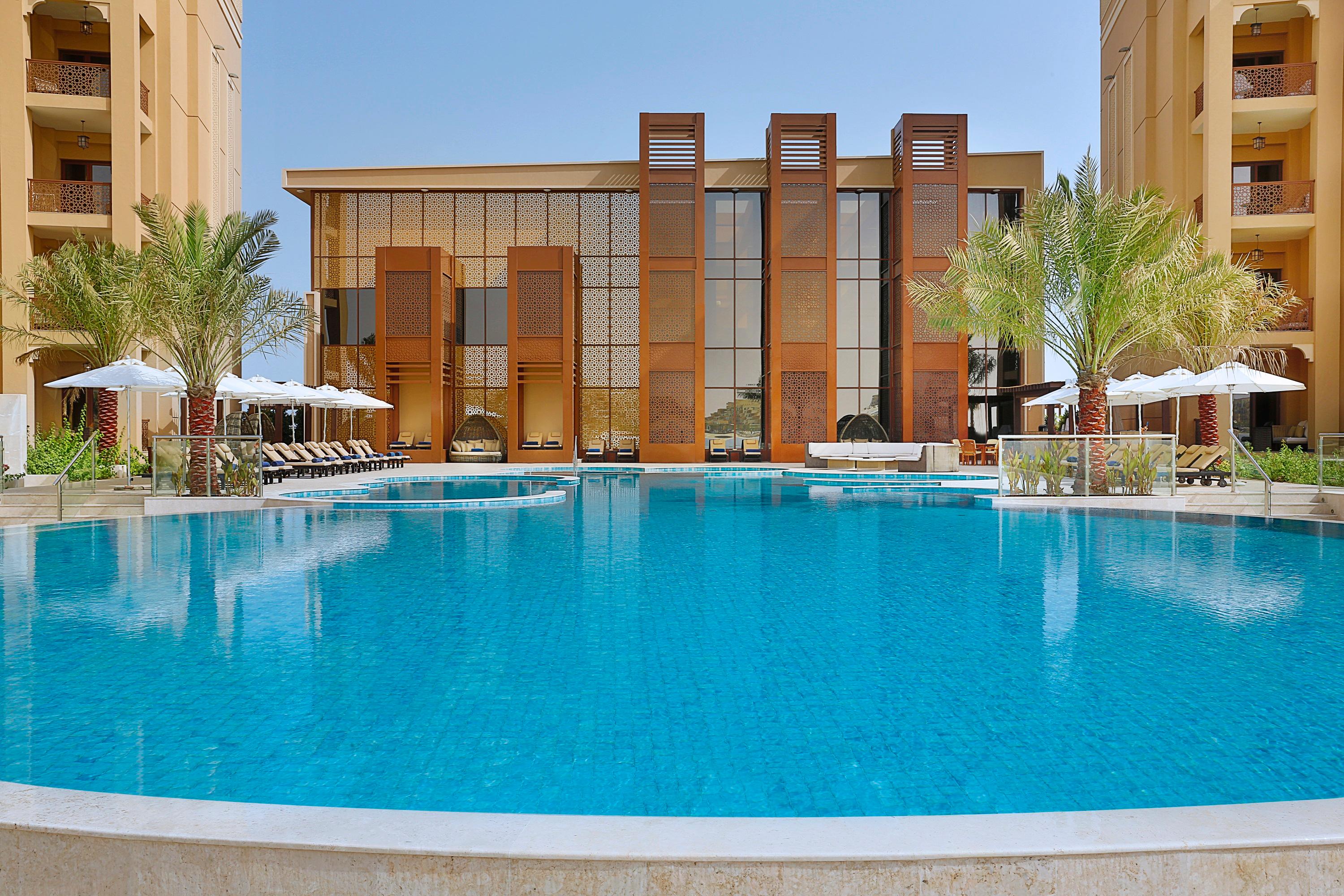 Outdoor pool area at the DoubleTree by Hilton Resort & Spa Marjan Island