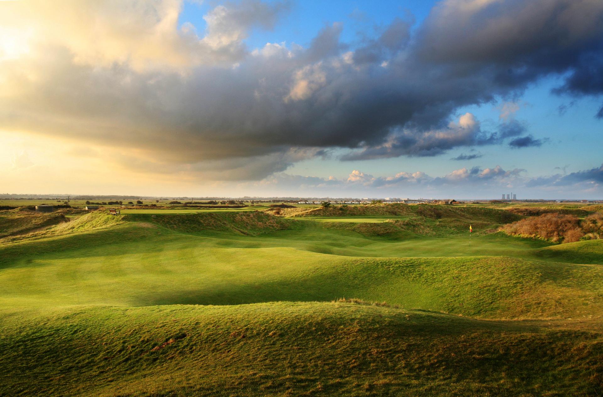 Panoramic view of a smooth green surrounded by rolling dunes